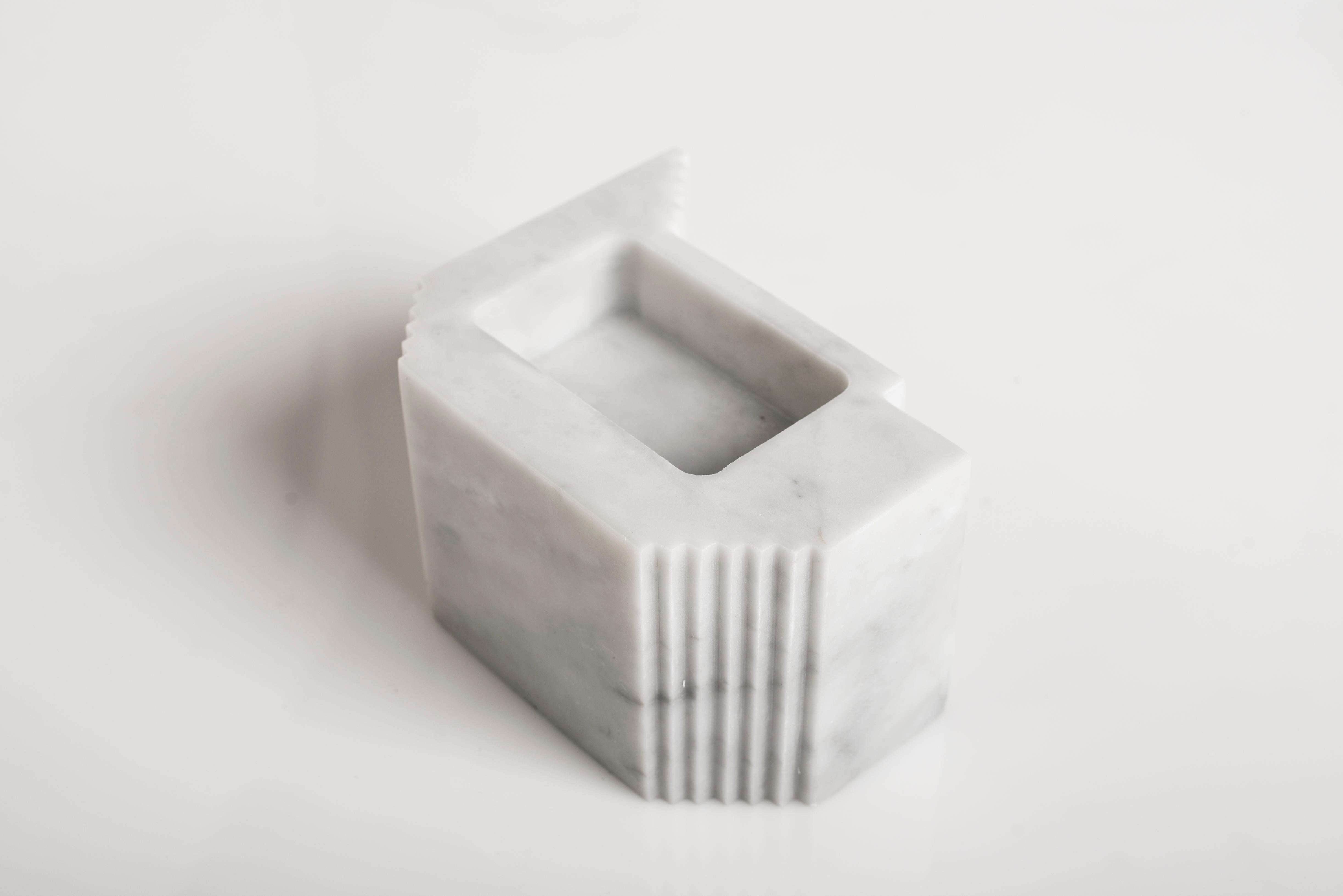 Treviso Sculpture by Carlo Massoud
Handmade 
Dimensions: D 12 x W 15 x H 9 cm 
Materials: Carrara Marble

Carlo Massoud’s work stems from his relentless questioning of social, political, cultural, and environmental norms. He often pushes his viewers