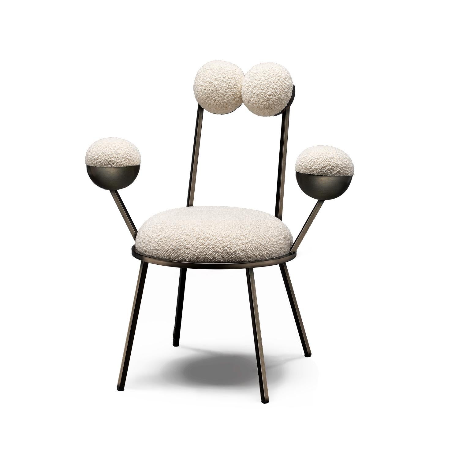 Trevor dining chair makes a perfect accompaniment for the tea room, its round spheres forming backrest and armrests, floating on thin metal rods, just like bonbons speared on cocktail sticks. Almost frog-like in its appearance, the chairs take the