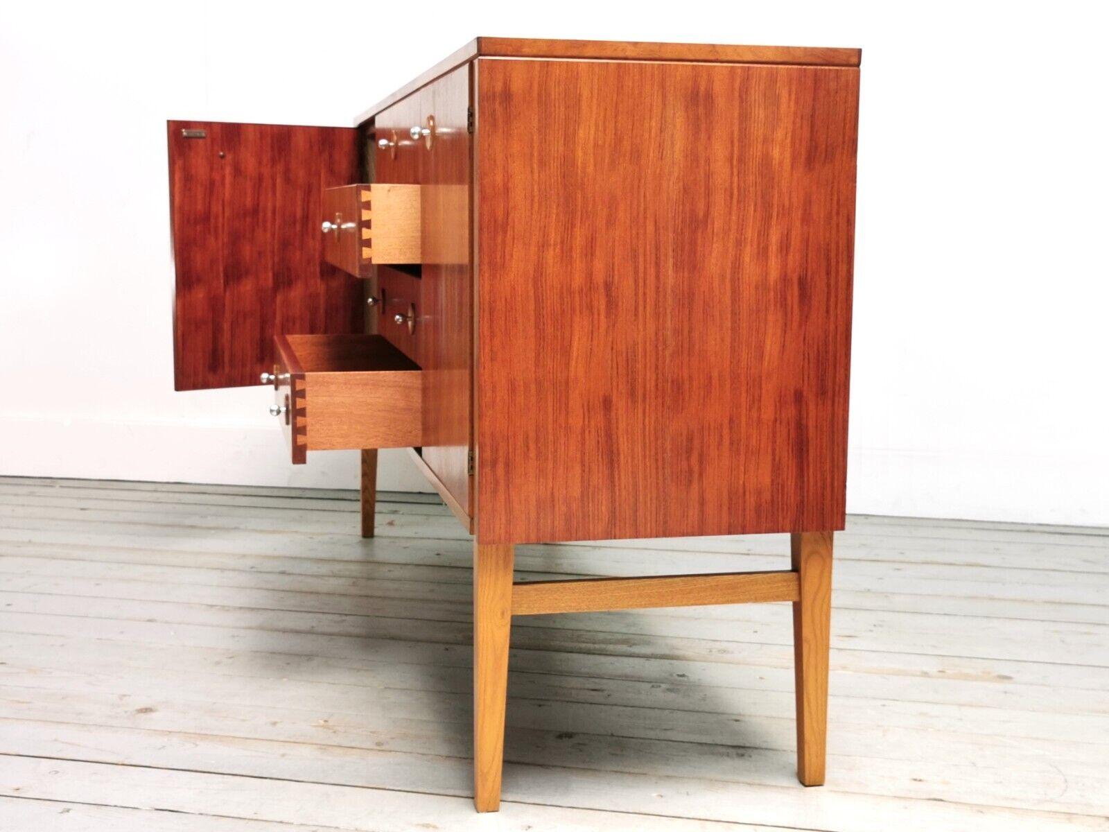 Gordon Russell sideboard 

This striking Model R.20 Sideboard was designed by Trevor Chinn and manufactured by Gordon Russell. 

Part of the Guiting Dining Group range was designed in 1960 and made of African walnut and contrasting