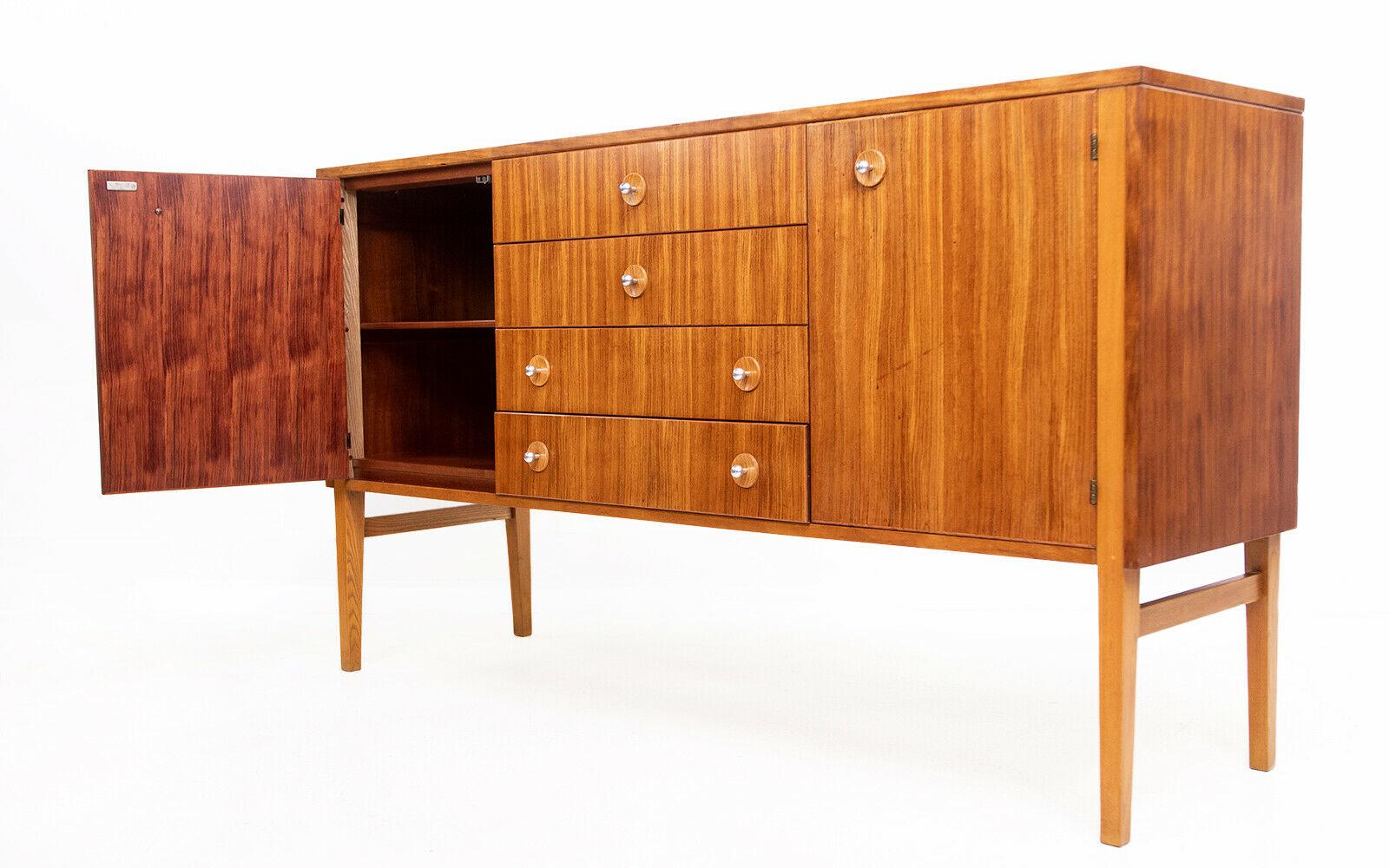 Gordon Russell sideboard 

This striking Model R.20 Sideboard was designed by Trevor Chinn and manufactured by Gordon Russell. 

Part of the Guiting Dining Group range was designed in 1960 and made of African walnut and contrasting oak. 

We