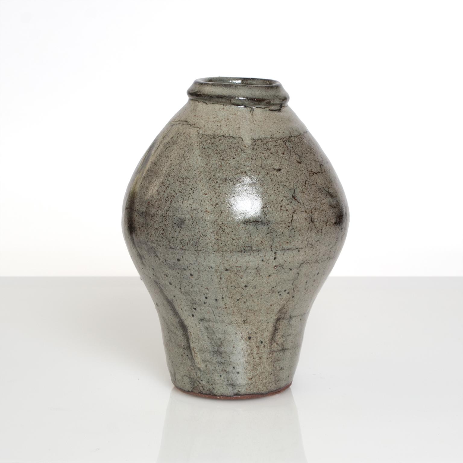 A wheel-thrown stoneware vase by Trevor Corser made at the The Leach Pottery in St. Ives, Cornwall, England. Corser started as an apprentice with the Leach Pottery in the 1960s and studied under Bernard Leach. He worked with Janet Leach until her