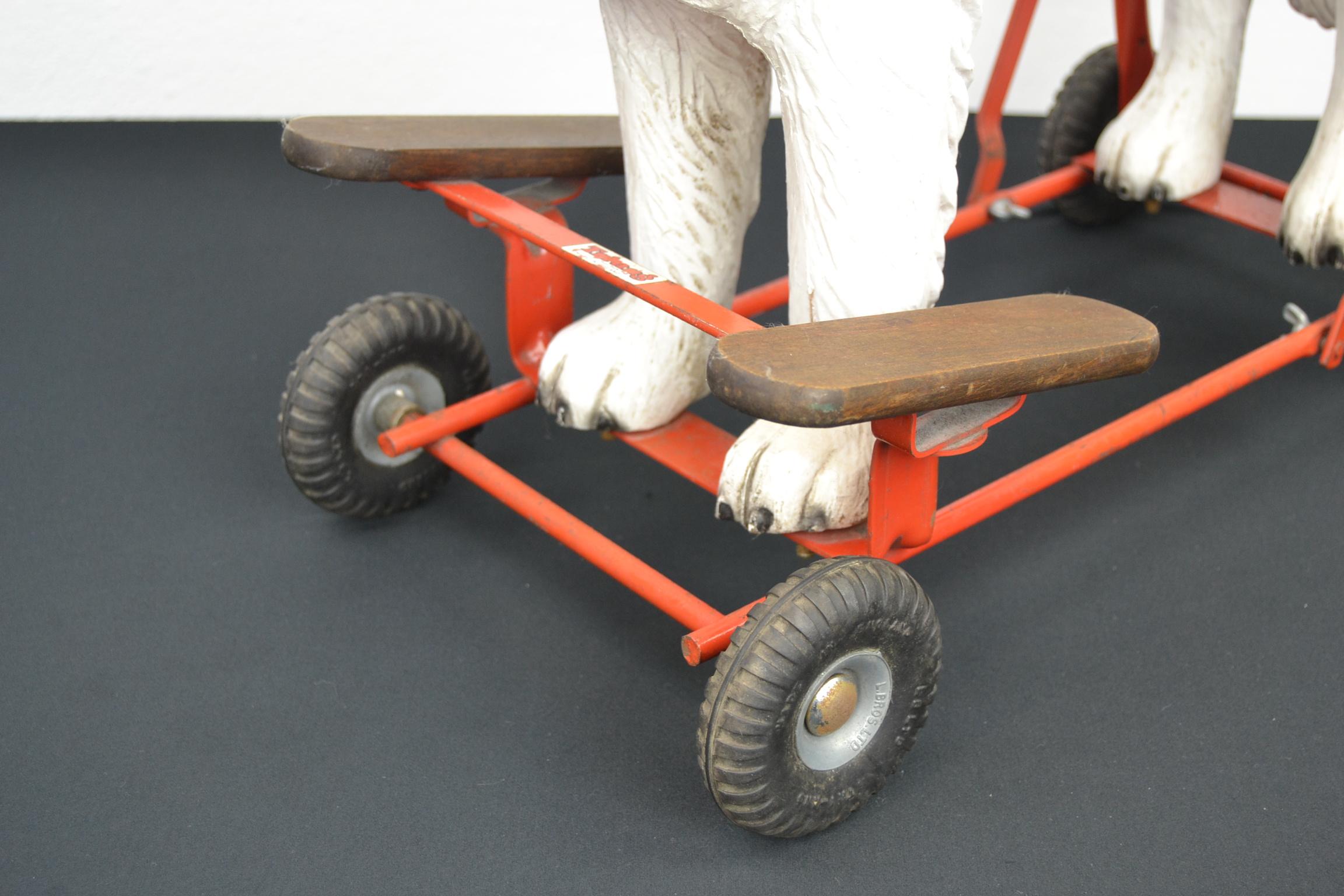stuffed dog on wheels