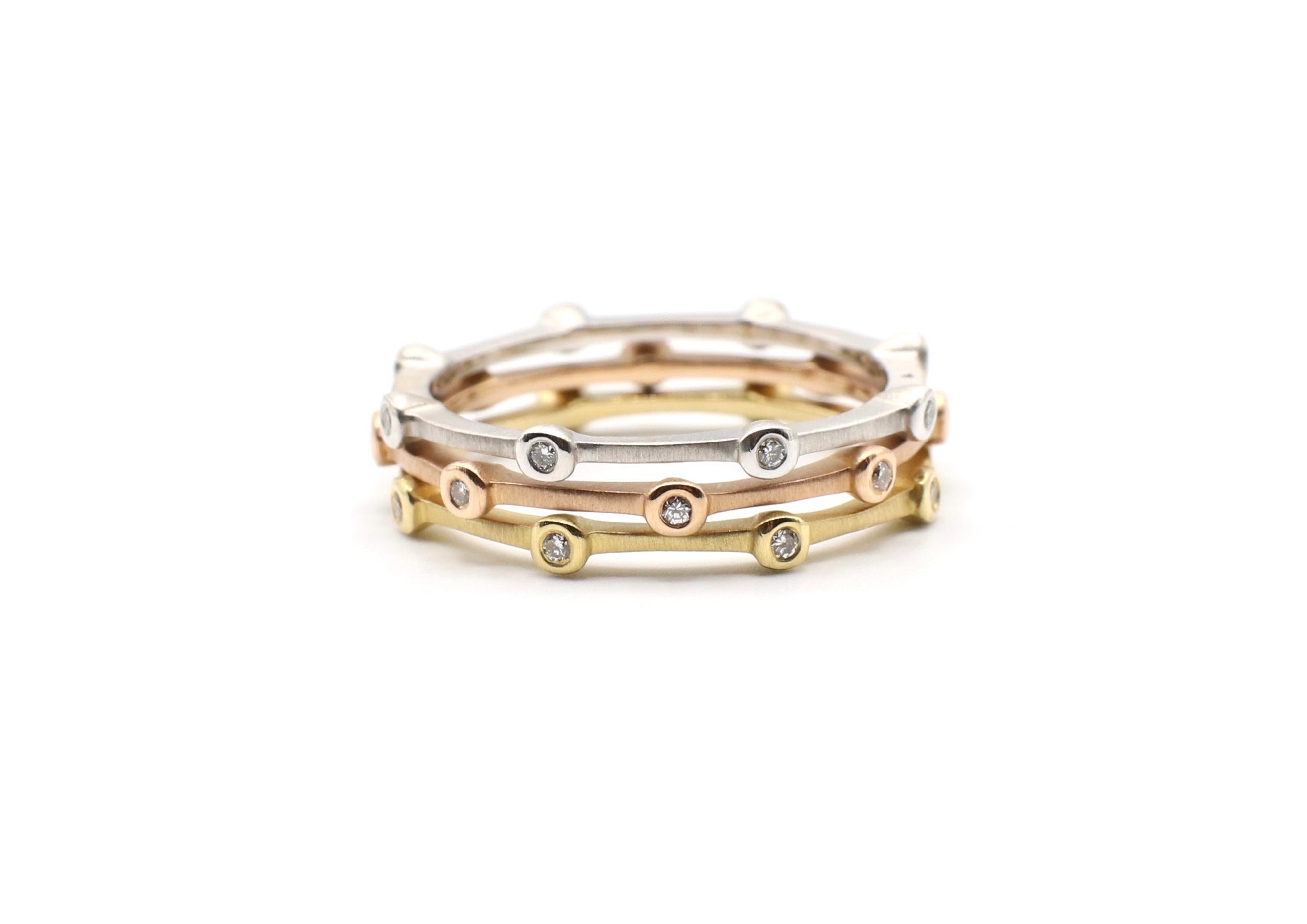 18K Tri-Color Natural Diamond Bamboo Style Stacking Ring Set of 3 Size 8.75

Metal: 18K white, rose & yellow gold
Weight: 6.04 grams
Diamonds: 24 round brilliant cut natural diamonds bezel set, approx. .25 ctw G VS 
3 Rings
Size: 8.75
Bands are 1mm