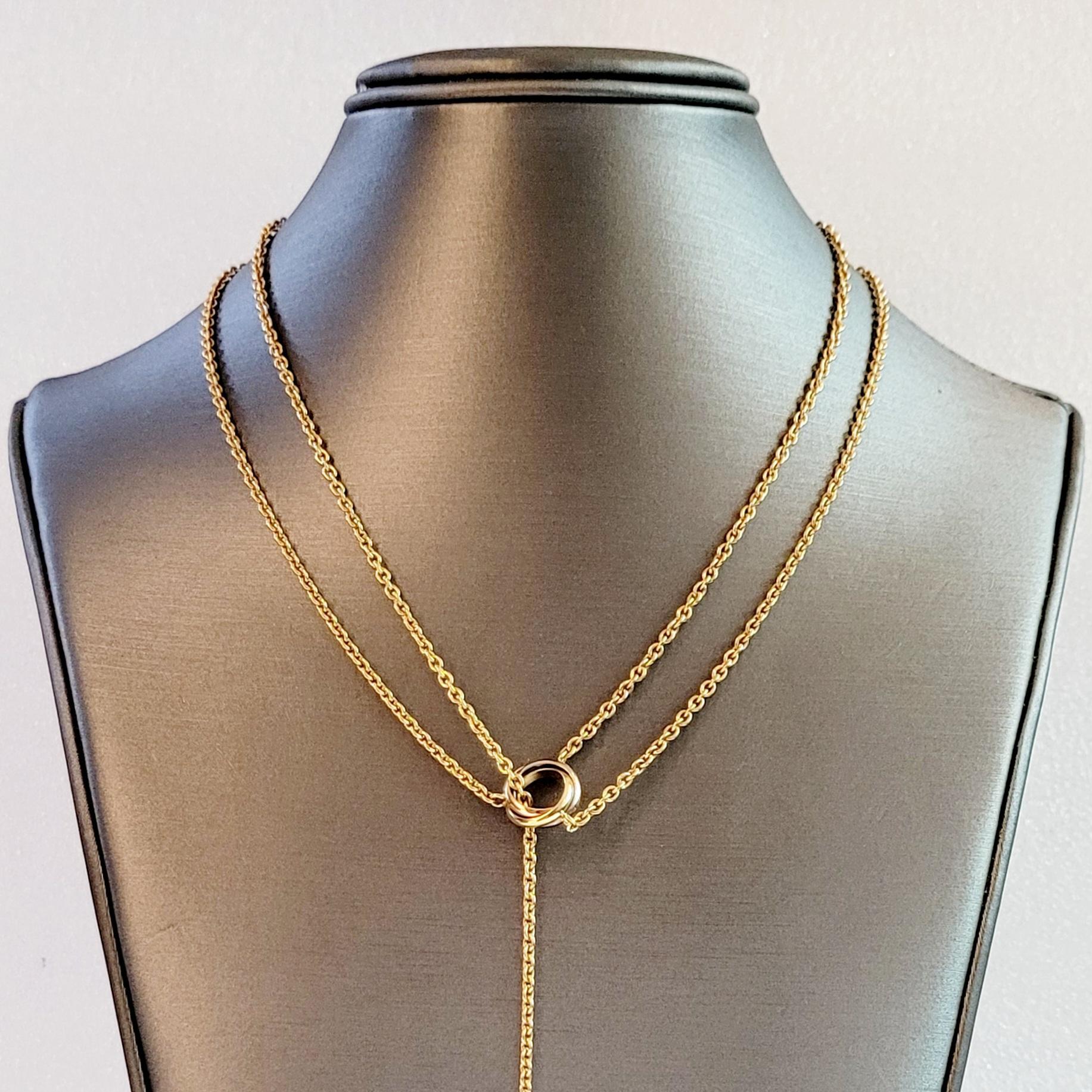 Tri-Color Gold Baby Trinity Pampilles Lariat Necklace by Cartier 
Type Necklace 
Material 18K Yellow Gold

Necklace Dimension:
From Motif to Ball 18'' Long 
From Lobster to Motif 7.5'' Long 
Total Length 26'' Long

Motif Dimension: 11.2 X4
