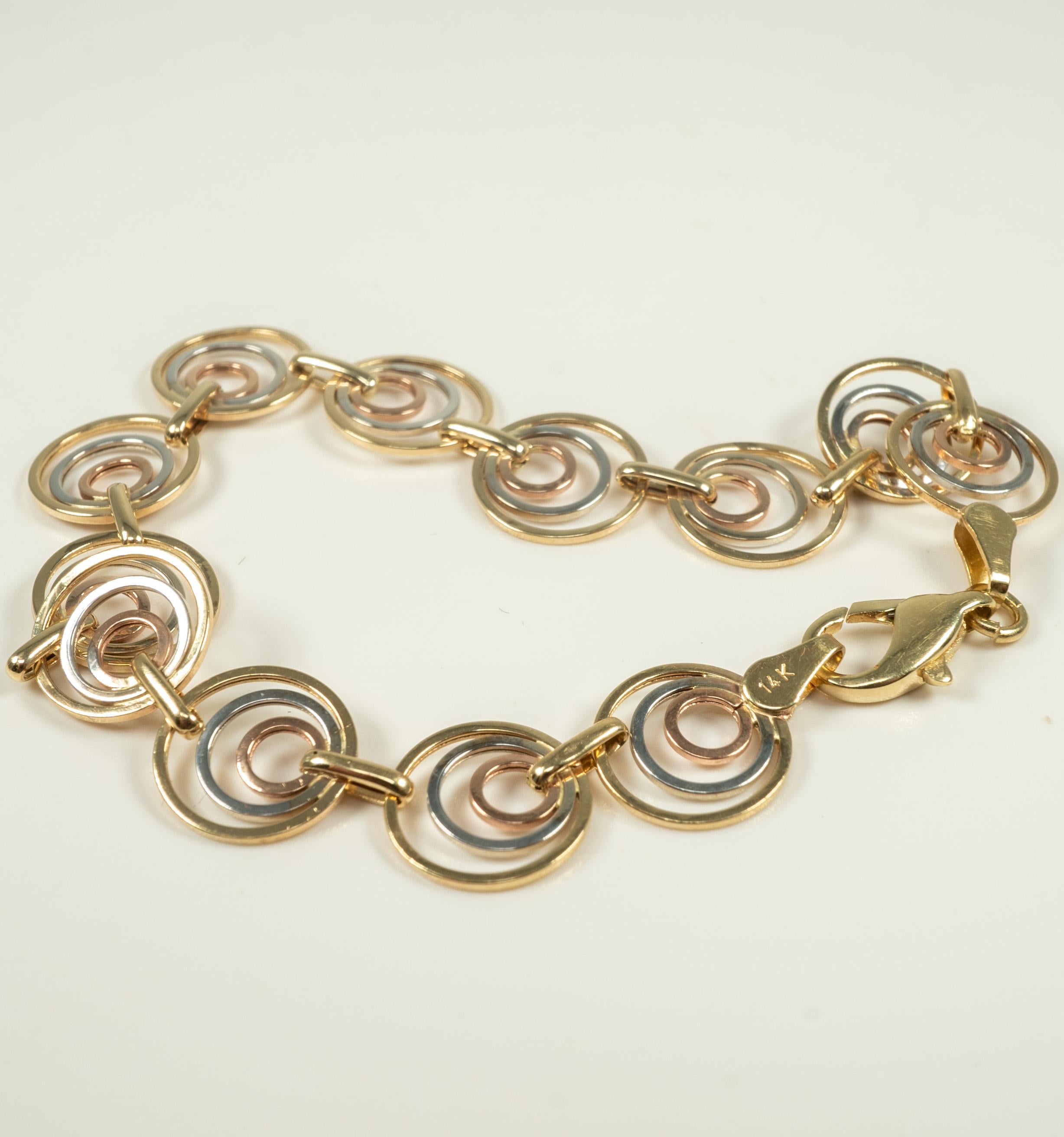 gold color bracelet with cirles in the middle