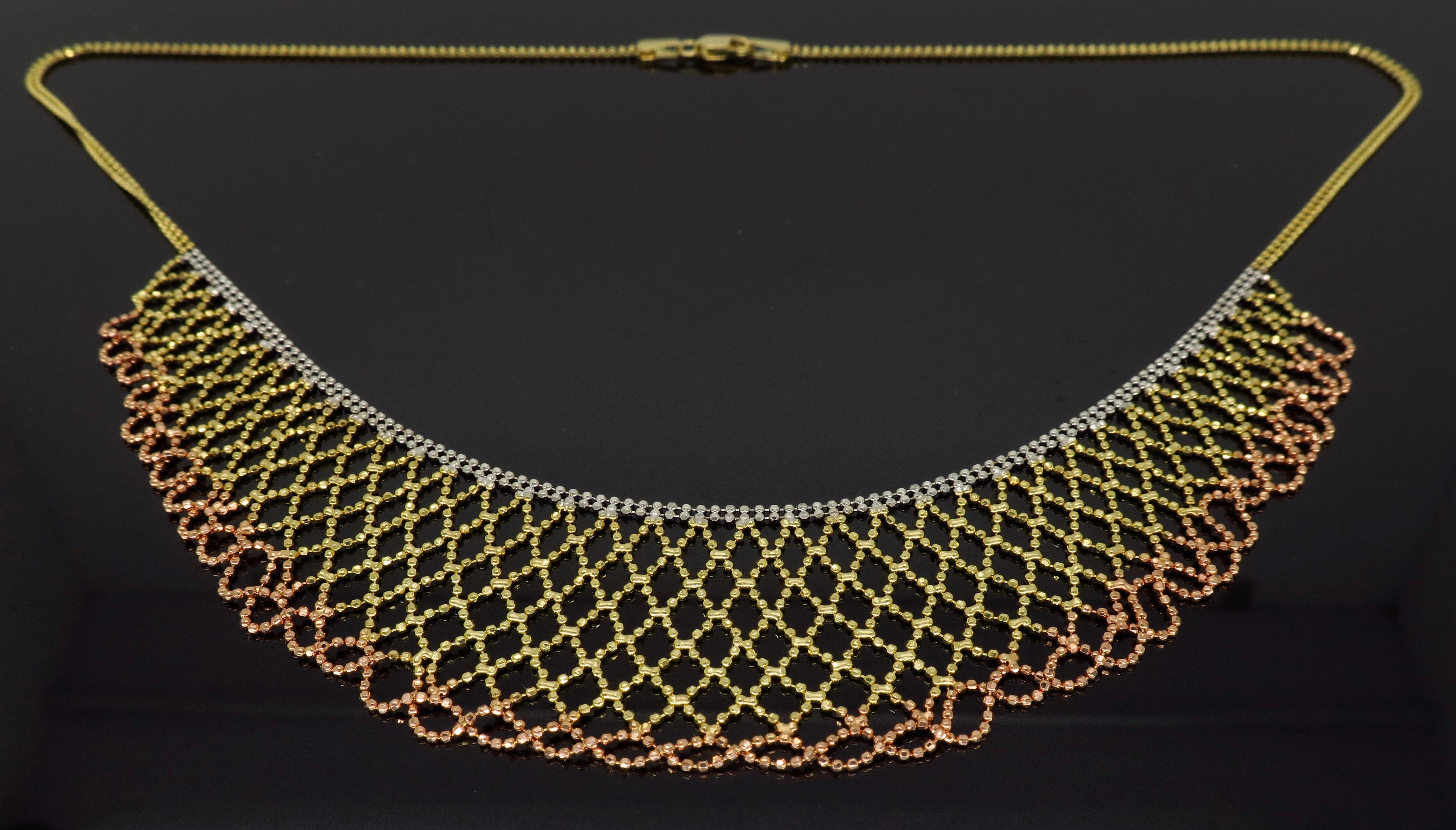 Unique collar style 14K tri-color gold necklace measuring approximately 17” in necklace length with the longest drop length being approximately 1.25” and weighing 10.2 grams. 
