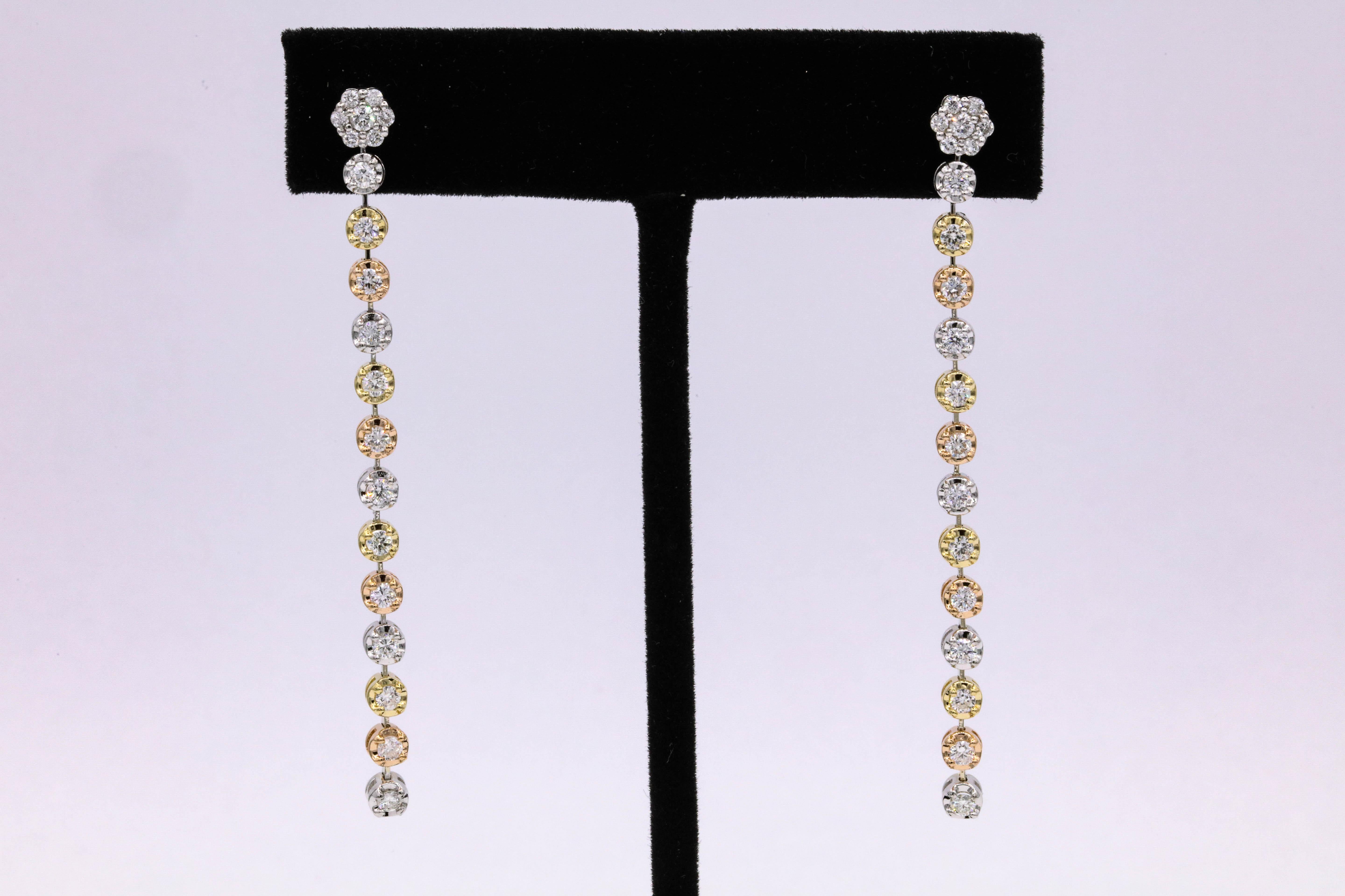 14K Tri-color drop earrings featuring 40 round brilliants weighing 1.50 carats.
Color G-H
Clarity SI