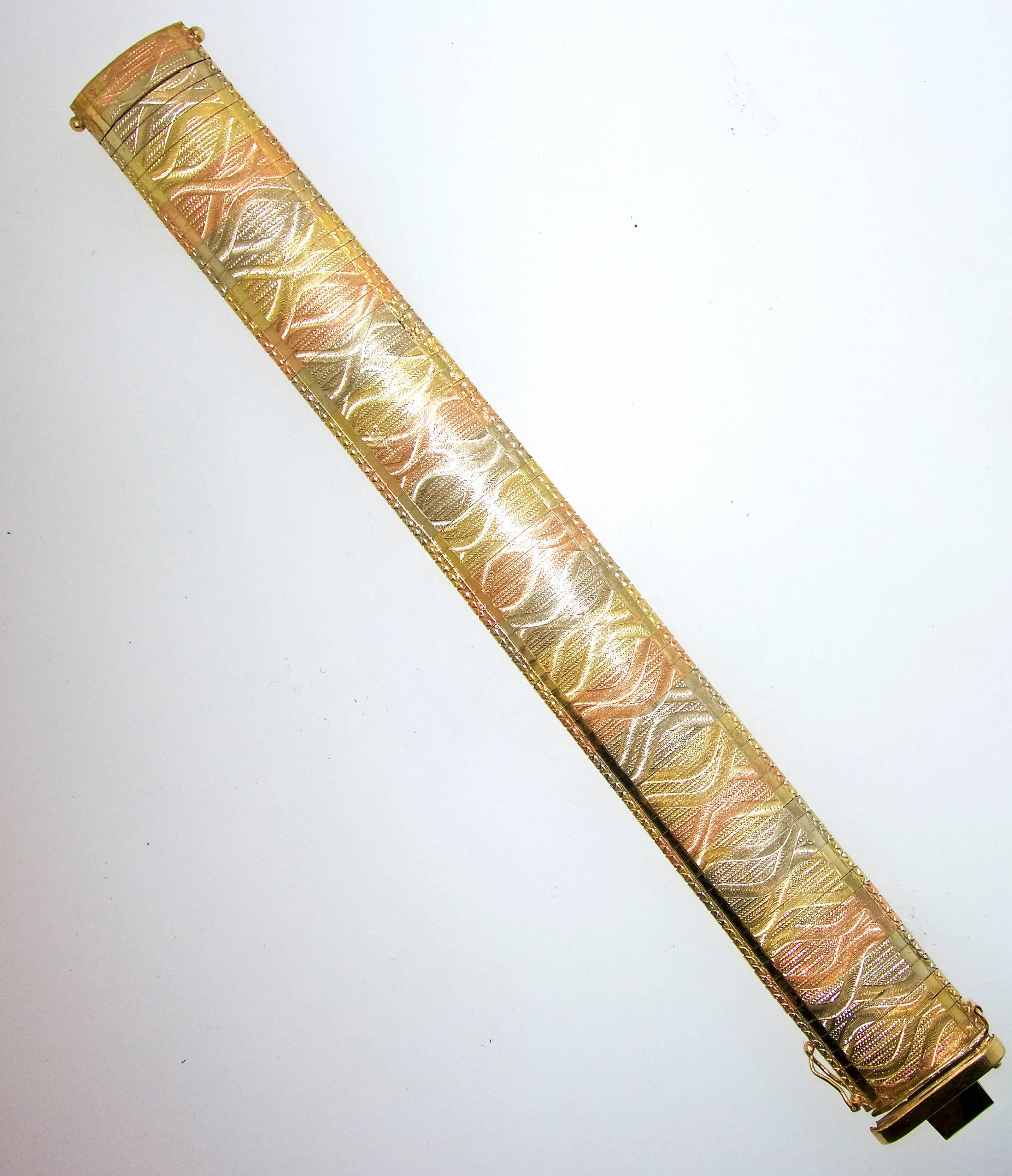 Gold colors vary from blue, pink, and greens (an unusual combination), in 14K.  There are 47 grams, this bracelet is 7.50 inches long and 13/16th inches wide.