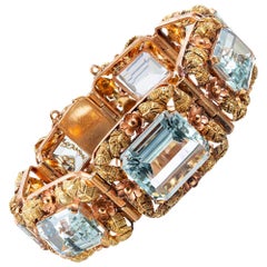 Tri-Color Gold Floral Motif Bracelet with Aquamarine
