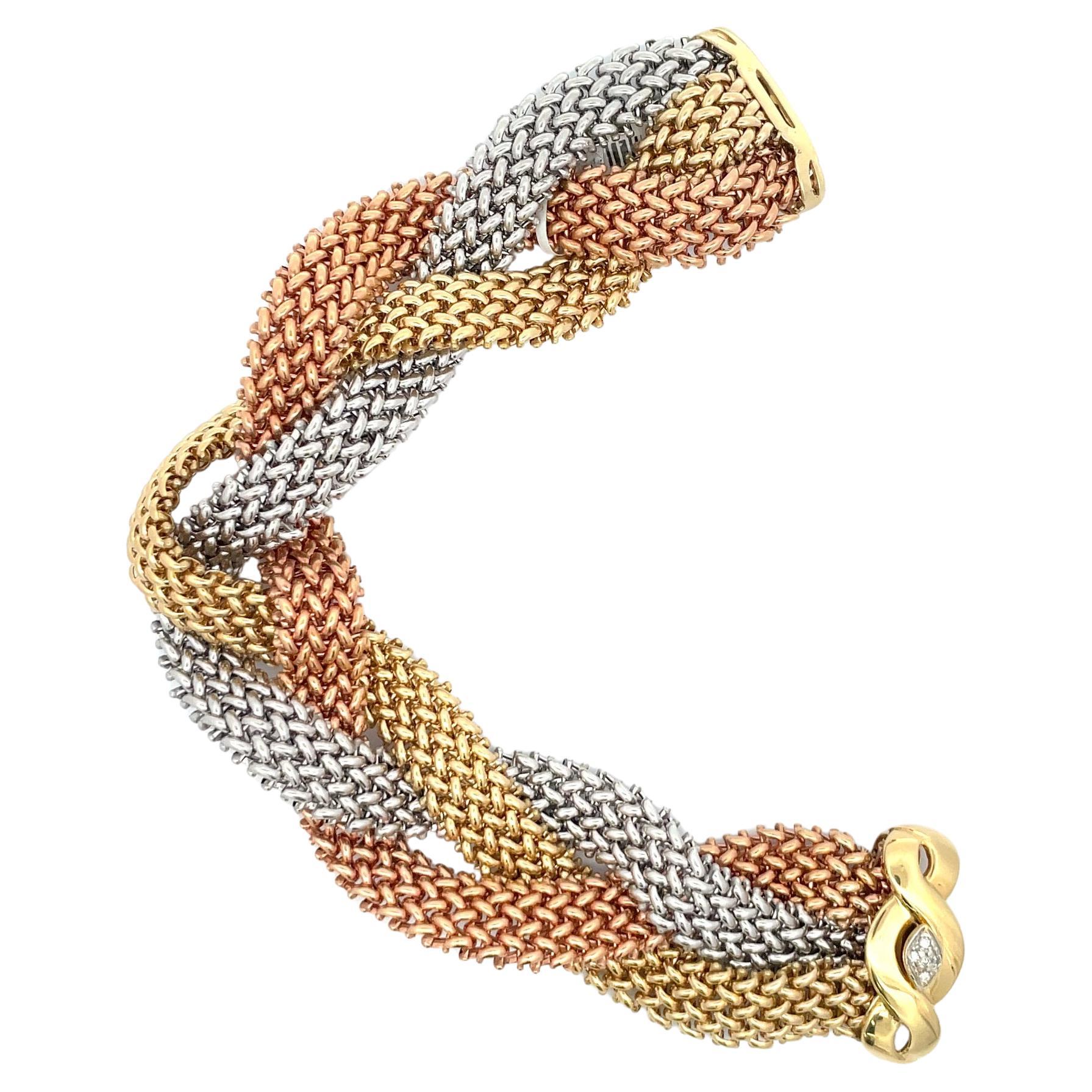 Tri-Color Yellow, White and Rose gold bracelet featuring a woven motif design and a decorative touch of a diamond clasp, 0.10 carats. 42.6 Grams 