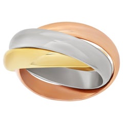 Tri-color rolling ring in 18k yellow, rose & white gold. Size 5