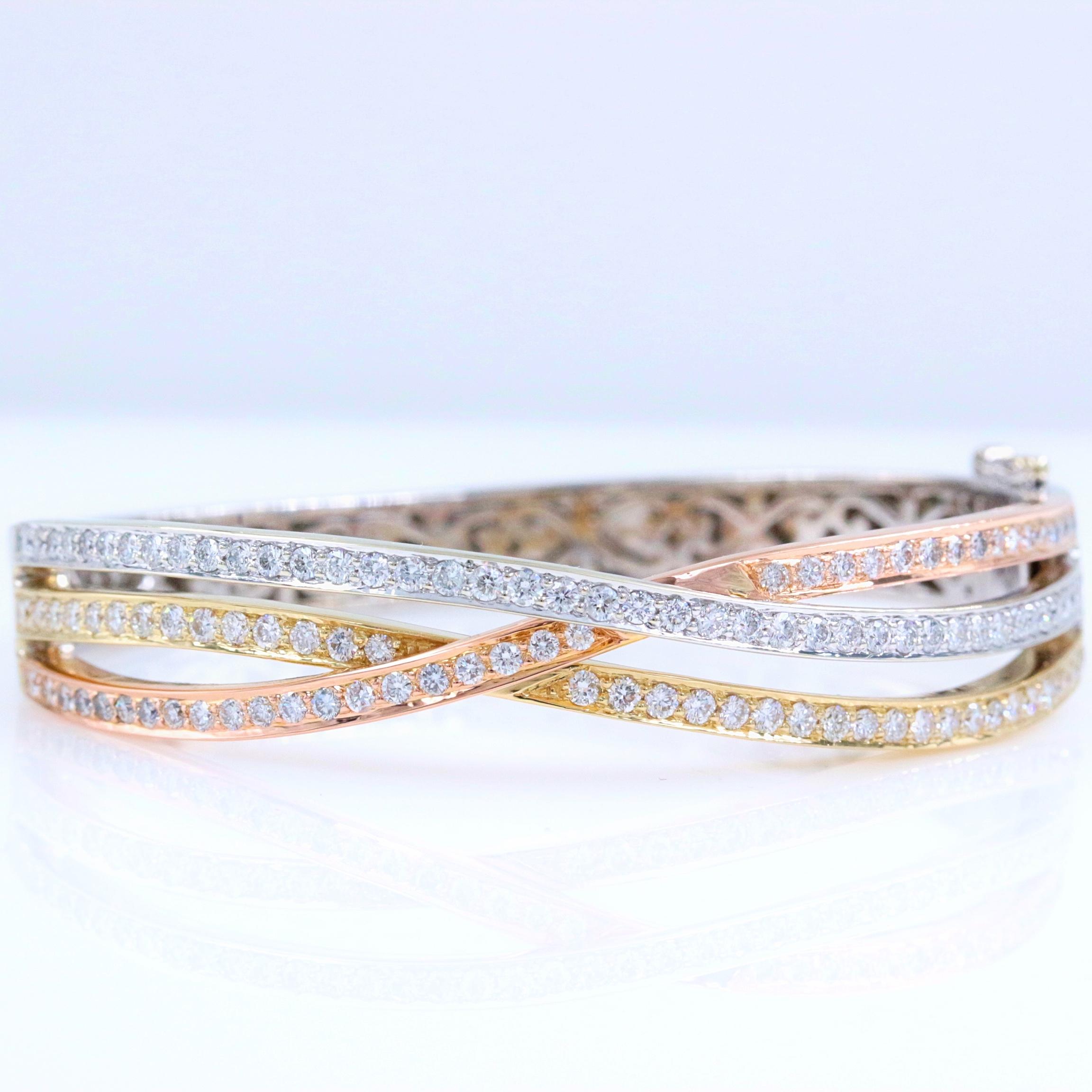 Tri-Color Round Diamonds Bangle Bracelet 
Style: Tri-Color Bangle Bracelet
Metal: 14kt White Yellow Rose Gold
Size: Small
Width: 10 MM at widest point
Measurements: 2.25 X 2 inches - 5.75 inches inside 
Total Carat Weight: 2.00 tcw
Diamond Shape: