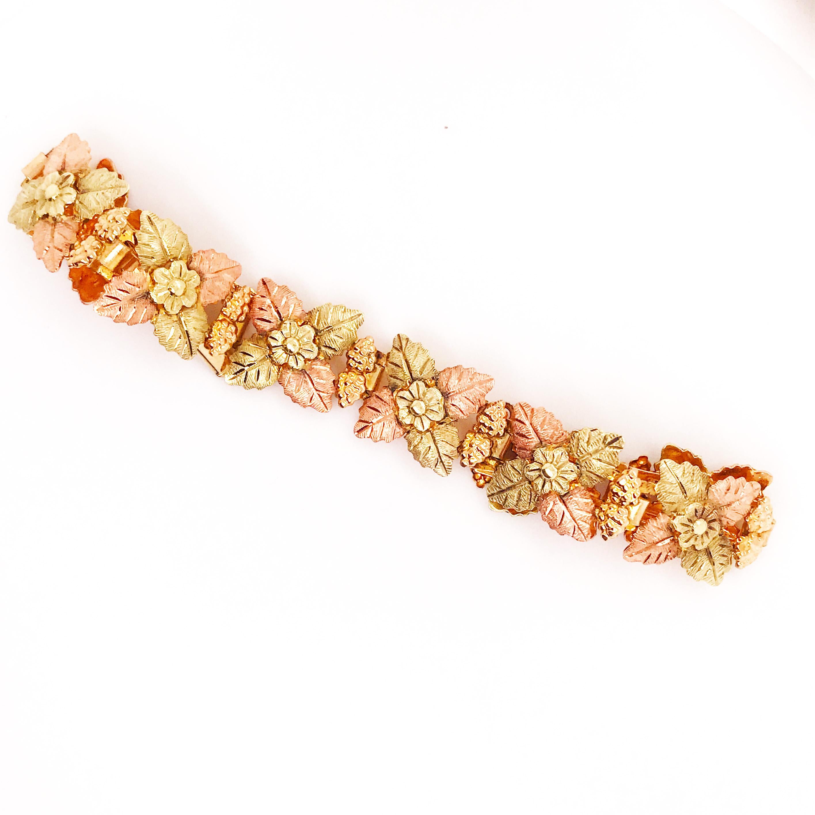 This is such a fun, unique fine jewelry accessory! This bracelet has a flower and leaf design with hand crafted texture and finished that are special to this piece. This is a statement bracelet with unique detail work and tri-color gold-rose, green,