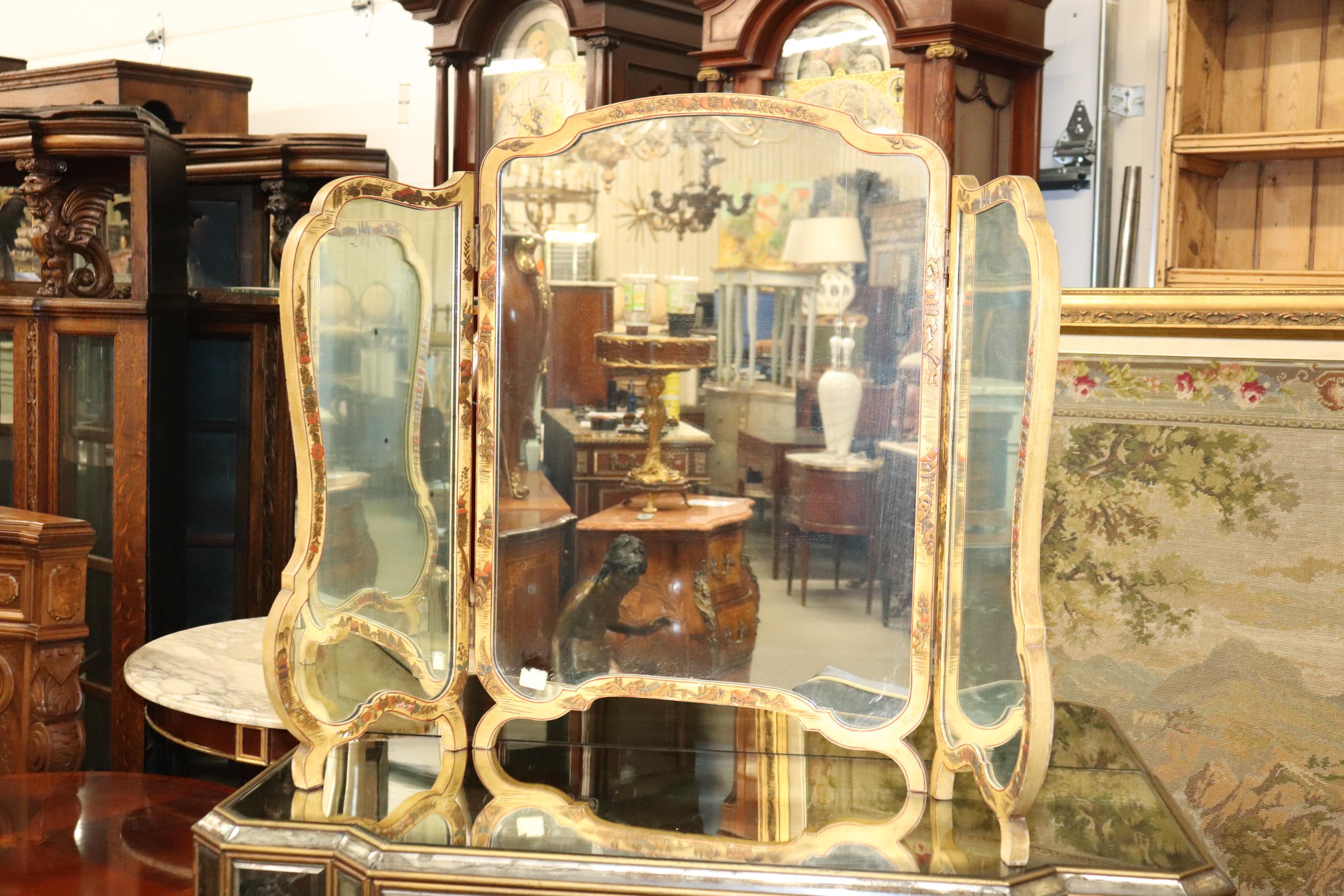 Beautiful mirror that can be hung or used as a vanity mirror for a makeup table. Measures 46 wide x 31 tall and is designed to fold and is in good condition with age appropriate wear to the finish. Dates to teh 1940s era.