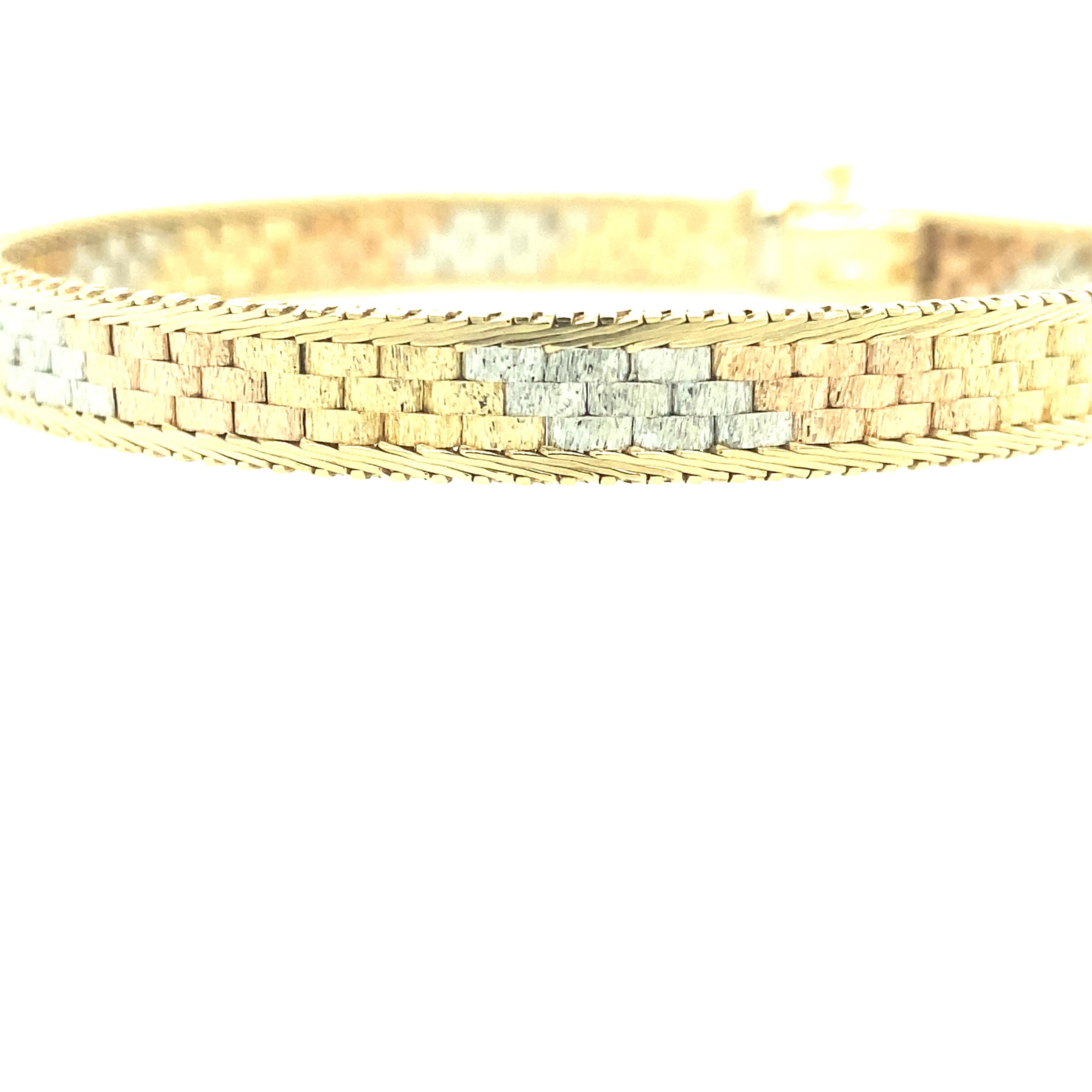 One 14 karat yellow, white and rose gold (stamped 14K ITALY NRK) mesh bracelet measuring 7 inches long complete with a box clasp and safety closure.