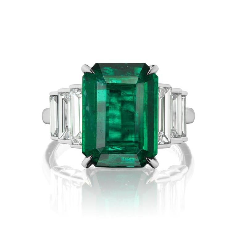TRI- LAYERED EMERALD AND DIAMOND RING A striking and architectural stepped diamond baguette and platinum setting is the perfect complement to an exquisite Zambian Emerald Item: # 03506 Metal: Platinum Lab: C.dunaigre Color Weight: 5.60 ct. Diamond