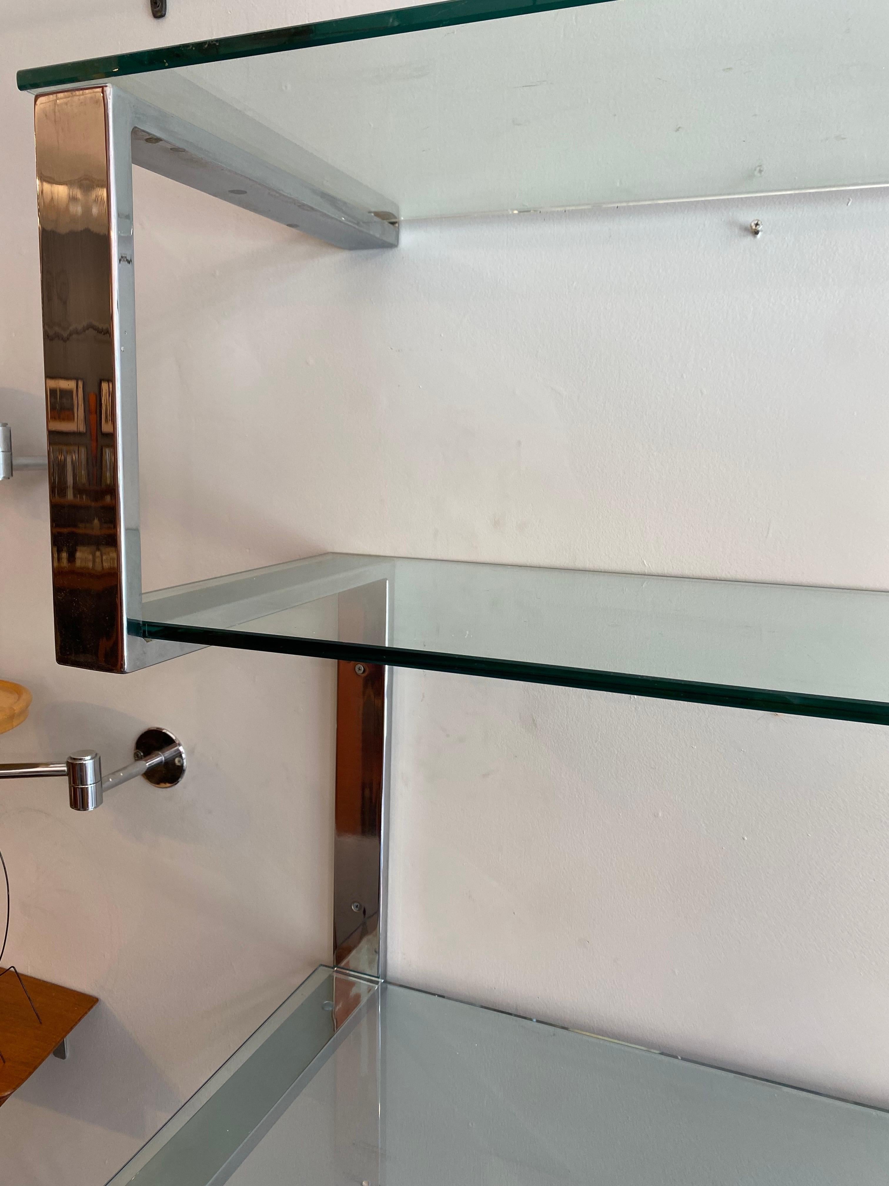 Tri-Mark Chrome and Glass Shelf from the mid 1970's.  Zig-Zag design mounts easily to a wall and is very solid!  Overall very clean, one glass shelf has a chip to rear edge and a little plating loss on some of the flat areas under the glass as seen