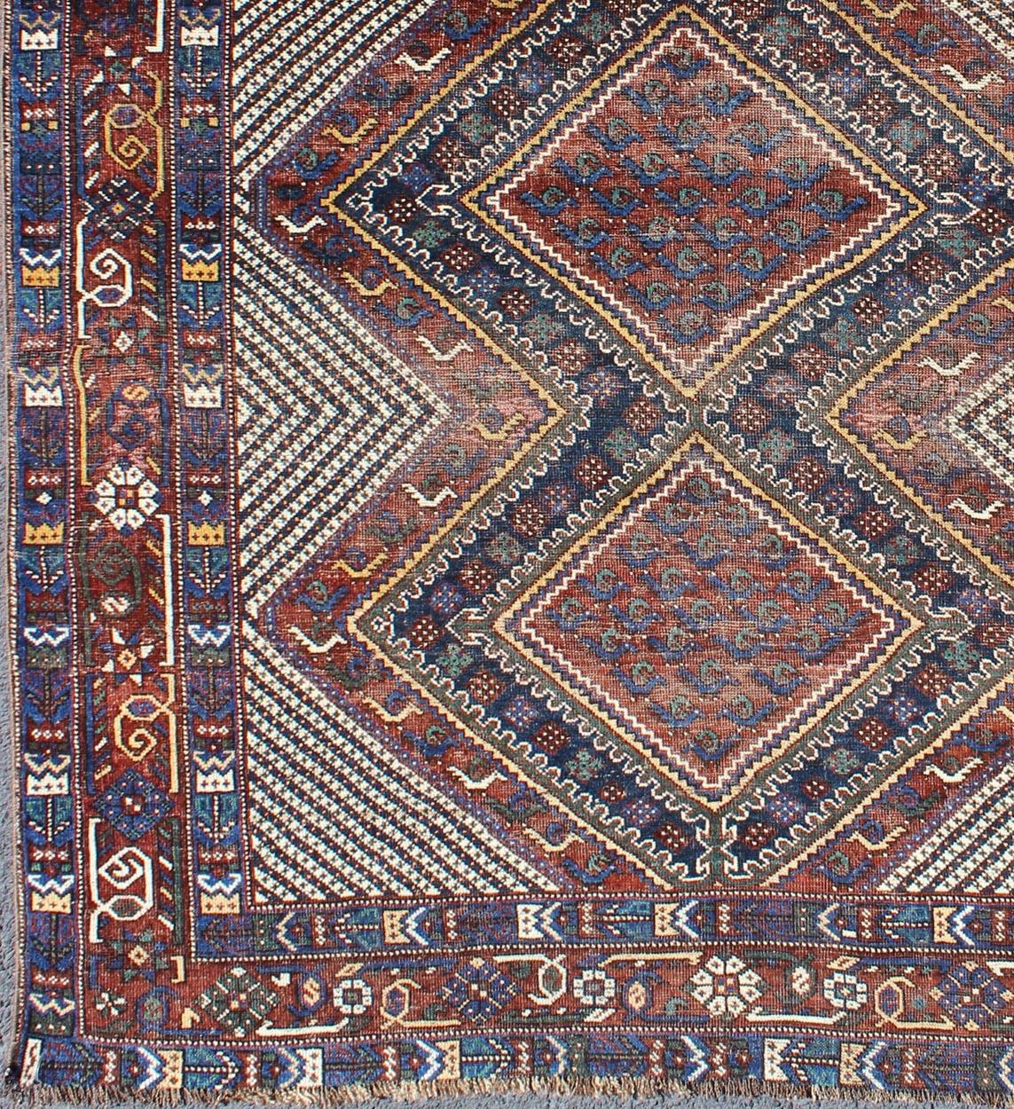 Multicolored Afshar Antique rug from Persia with unique diamond geometric design, rug gng-4772, country of origin / type: Iran / Afshar, circa 1910s.

Bold geometry, rich symbolism, and vivid coloration enhance the marvellous beauty of this