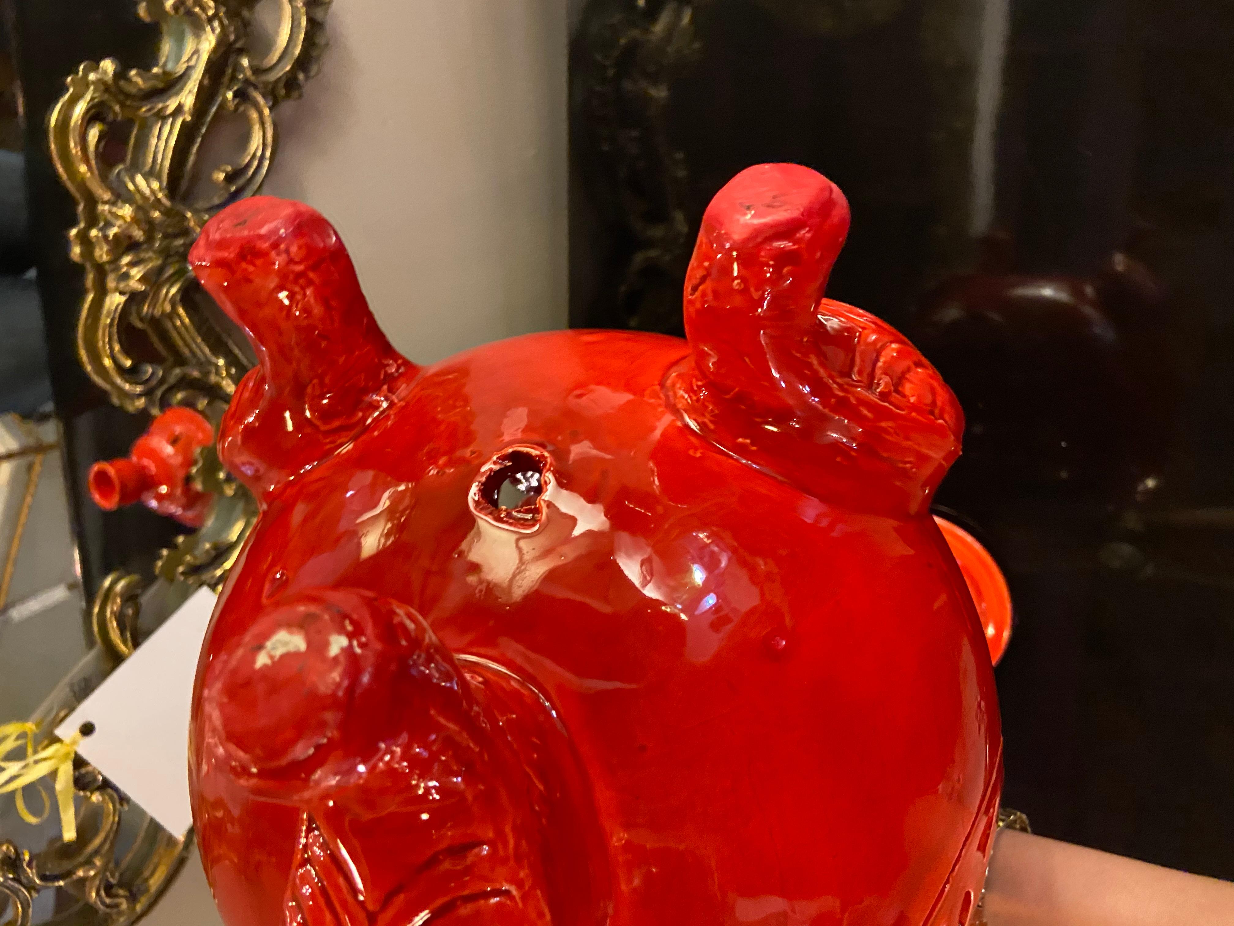 This stylish and one of a kind tri-pod leg fire engine red lidded urn is handmade and is an exquisite piece of pottery to decorate any space and bring style to your living space. This urn can be wired and used as table lamp.