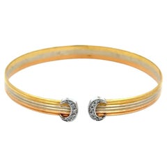 Bracelet jonc vintage en or tricolore avec diamants