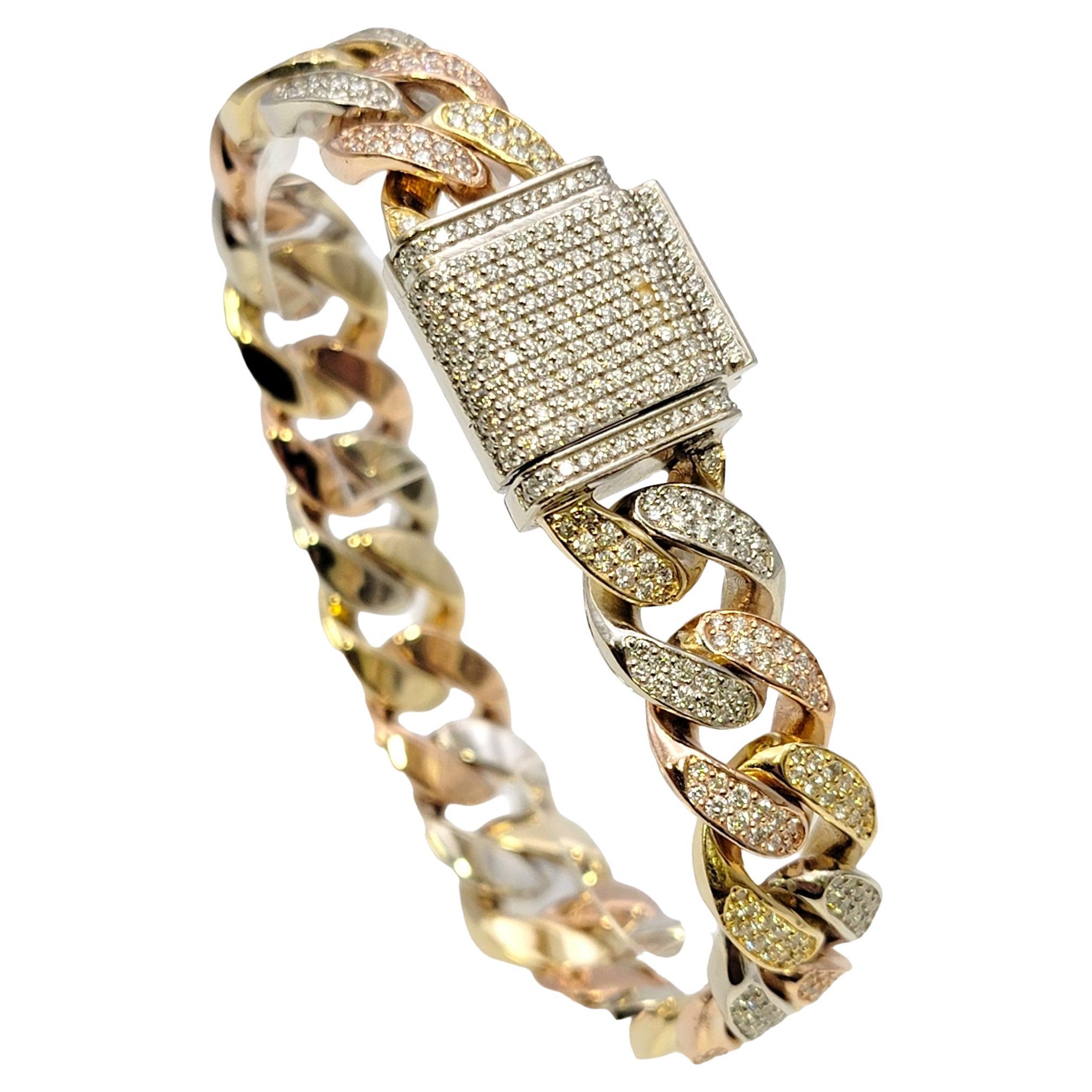 Impressive unisex cuban link bracelet with glittering pave diamonds. The wide, tri-toned links hug the wrist for a comfortable and secure fit, while the shimmering diamonds sparkle from all angles. 

This striking bracelet features chunky cuban