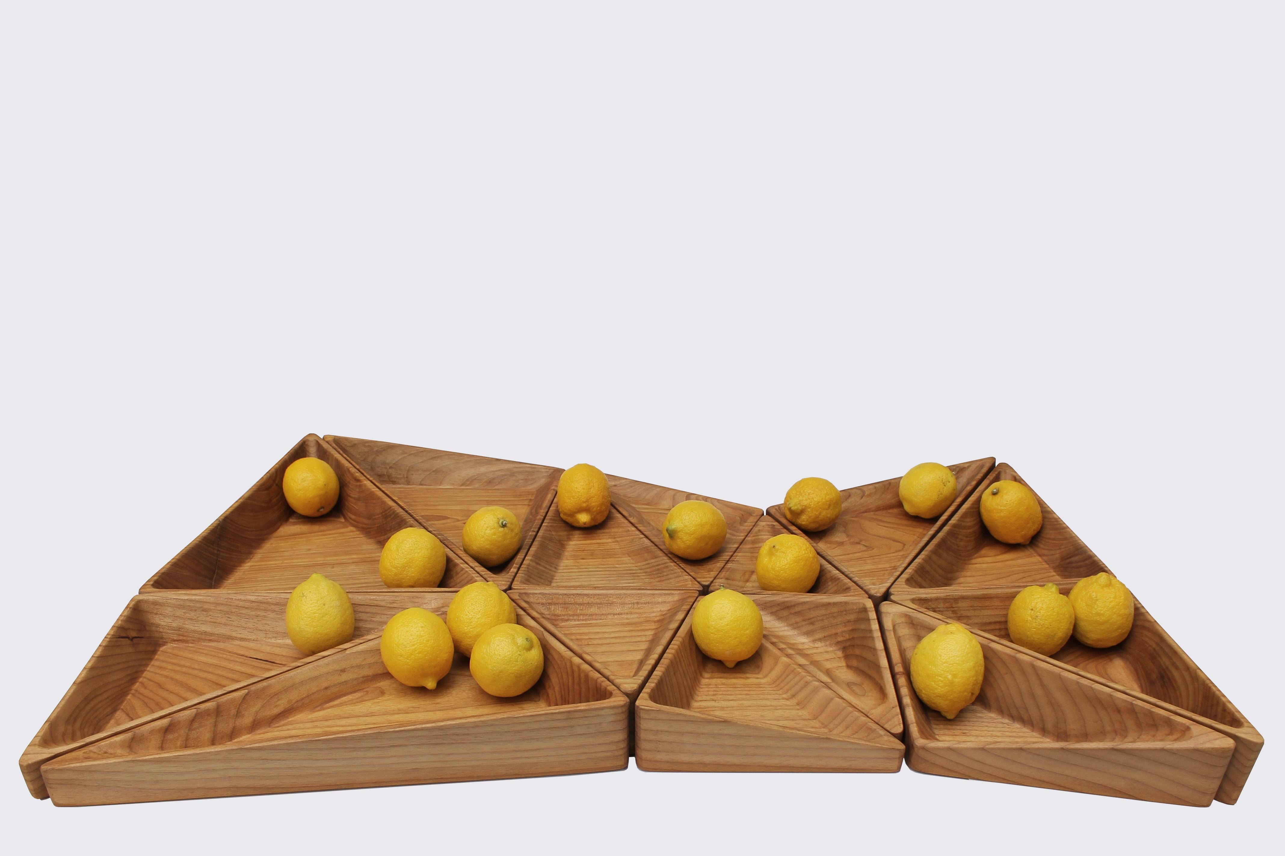 TRI - Wood centerpiece 14 pieces.

The TRI centerpiece was developed from the distortion of a grid of triangles on the 3 axes, which provides a complex geometry of reentrances and saliences for storage. There are 14 pieces that can be purchased