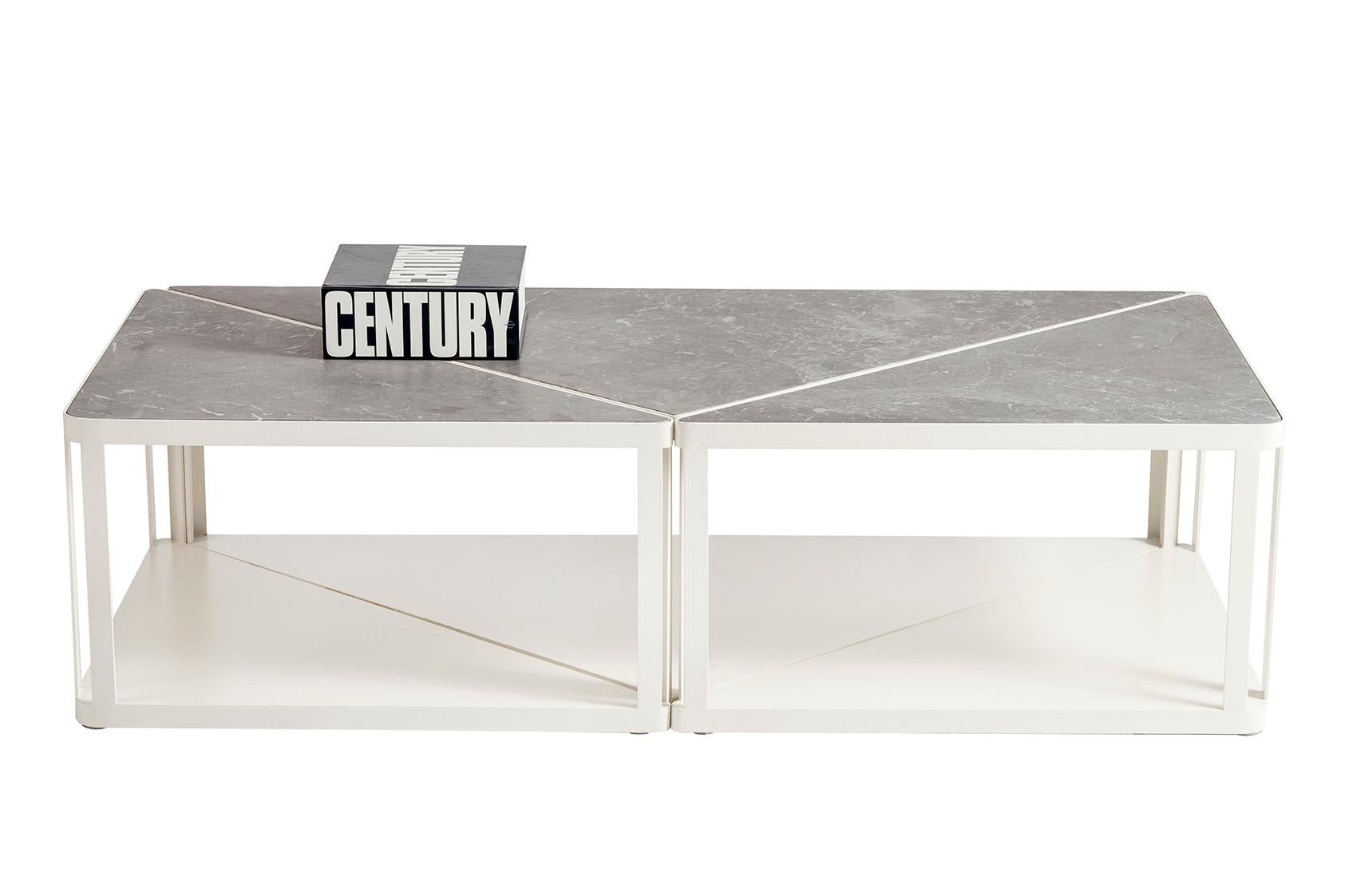 Tri-zone is a centre table with two sides which consists marble top and a metal body.