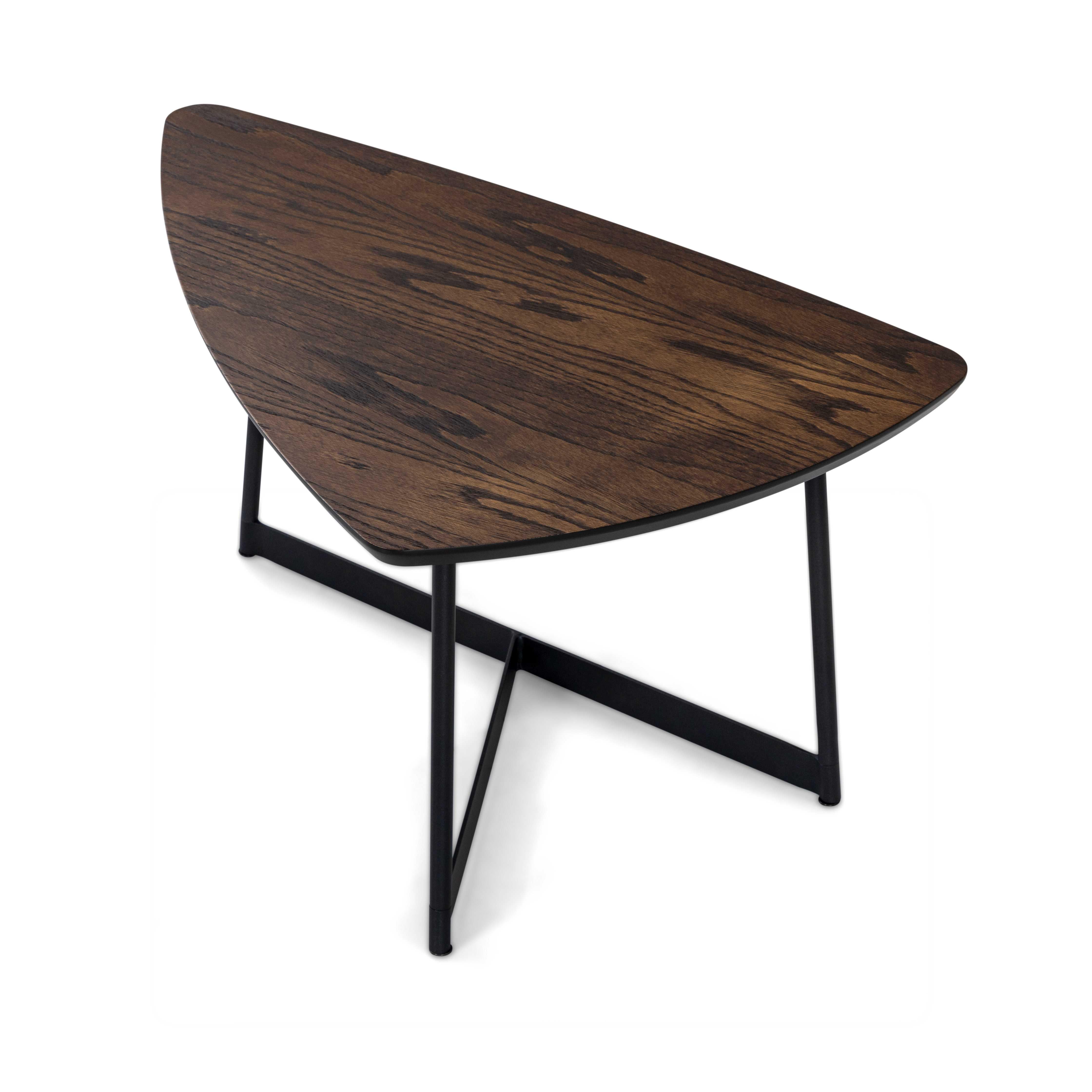 A Tria coffee table designed by Sérgio Batista for Uultis with dark oak 27-Inch veneered top and black metal base. The Tria Coffee Table, crafted with a 27-inch dark oak veneered top and a sleek black metal base, brings a bold yet minimalist