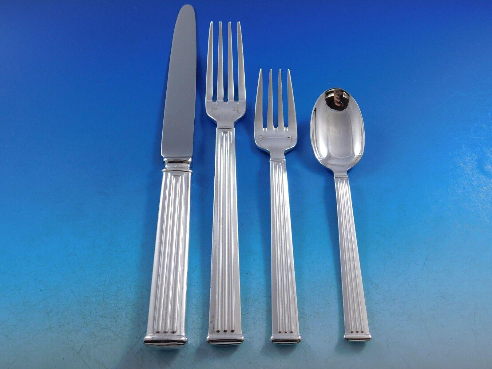Modern clean lines in a Classic column motif makes this pattern, Triade, forever timeless. 
Monumental Dinner Size Triade by Christofle France Silverplated Flatware set - 160 pieces. This set includes:

12 Dinner Knives, 9 3/4