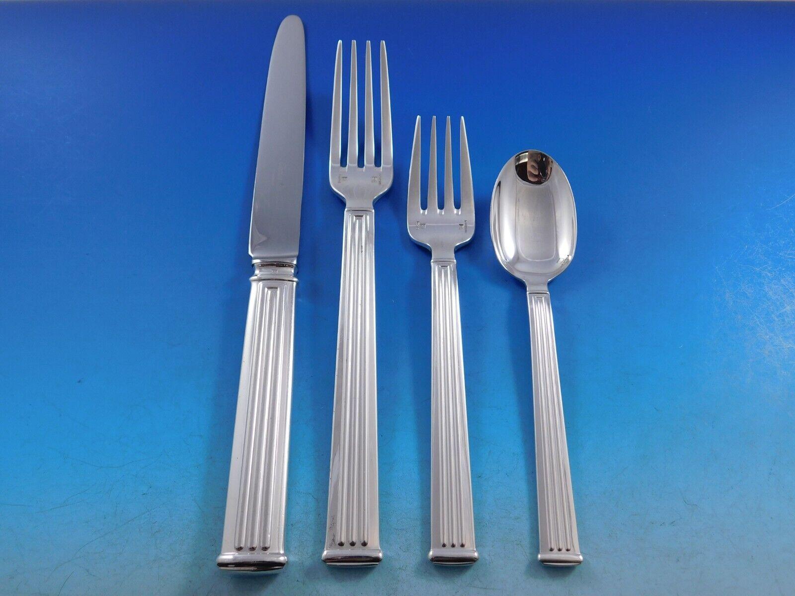 Modern clean lines in a Classic column motif makes this pattern, Triade, forever timeless. 
Dinner Size Triade by Christofle France Silverplated Flatware set - 76 pieces. This set includes:

12 Dinner Knives, 9 3/4