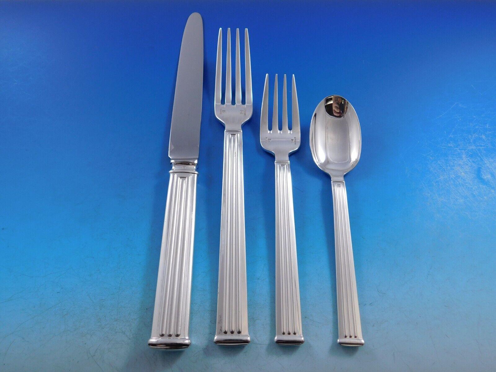 Modern clean lines in a Classic column motif makes this pattern, Triade, forever timeless. 
Dinner Size Triade by Christofle France Silverplated Flatware set - 66 pieces. This set includes:

8 Dinner Knives, 9 3/4