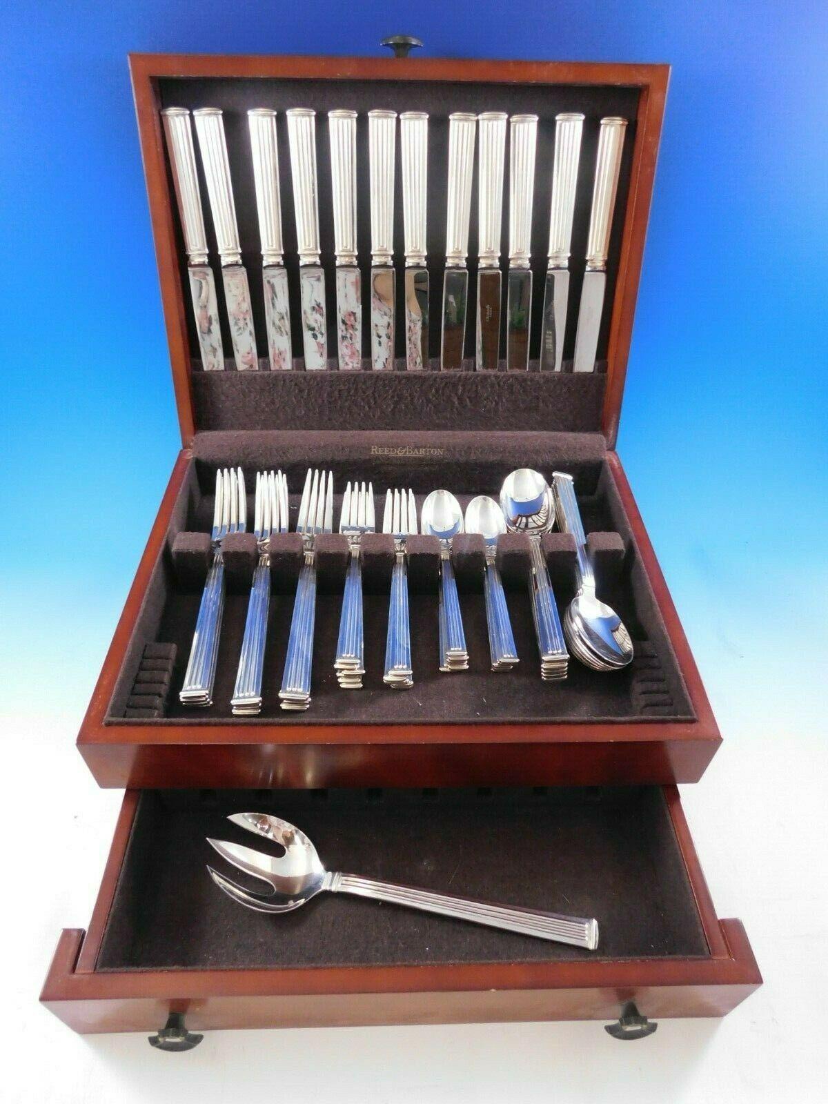 Modern clean lines in a Classic column motif makes this pattern, Triade, forever timeless. 

Dinner Size Triade by Christofle France Silverplated Flatware set - 61 pieces. This set includes:

12 dinner knives, 9 3/4