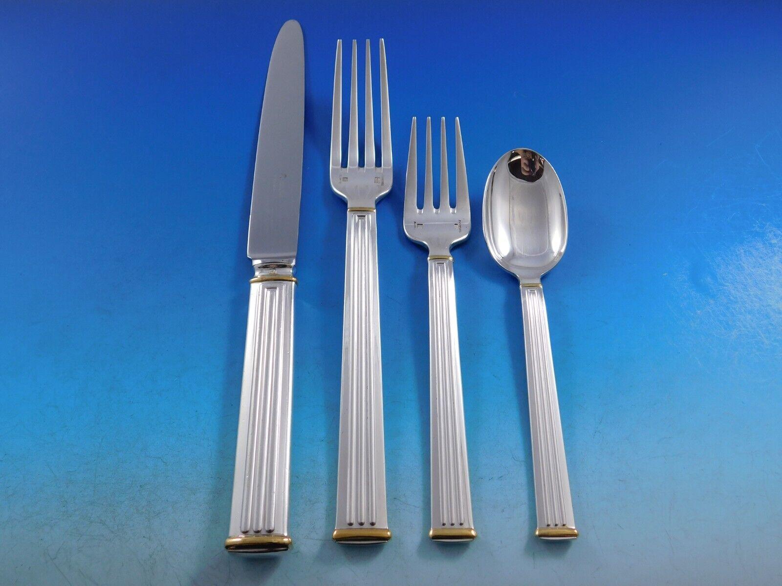 Modern clean lines in a Classic column motif makes this pattern, Triade, forever timeless. 

Dinner Size Triade Gold Accent by Christofle France Silverplated Flatware set - 66 pieces. This set includes:

8 Dinner Knives, 9 3/4