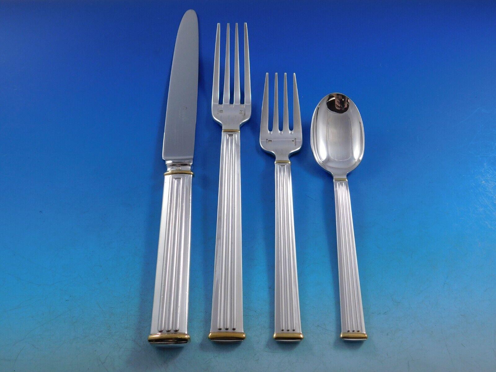 Modern clean lines in a Classic column motif makes this pattern, Triade, forever timeless. 
Dinner Size Triade Gold Accent by Christofle France Silverplated Flatware set - 76 pieces. This set includes:

12 Dinner Knives, 9 3/4