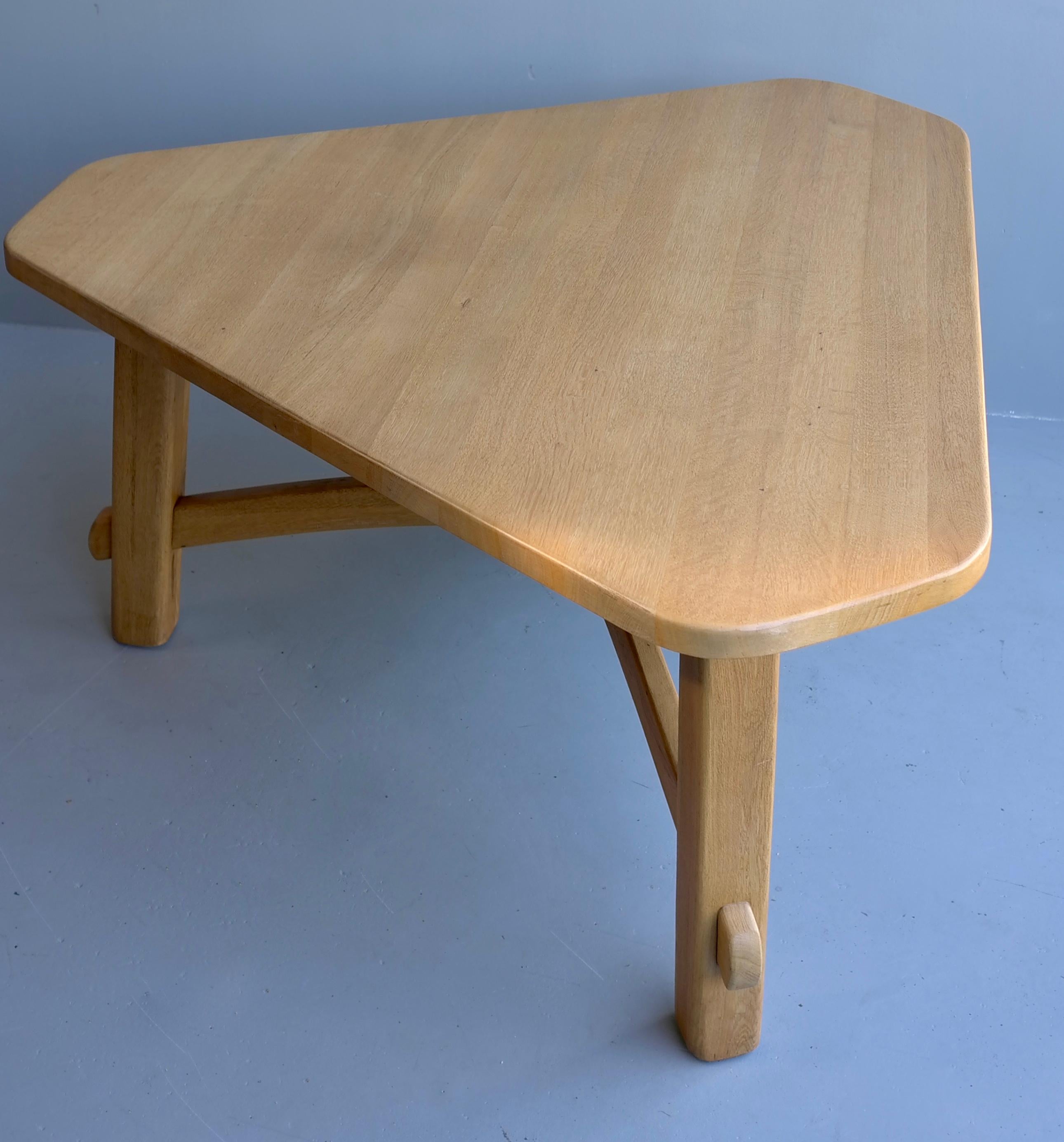 Triangel solid oak dining table in style of Pierre Chapo, France 1960's

Two chairs can be placed on each side, or more spatially one on each side.
