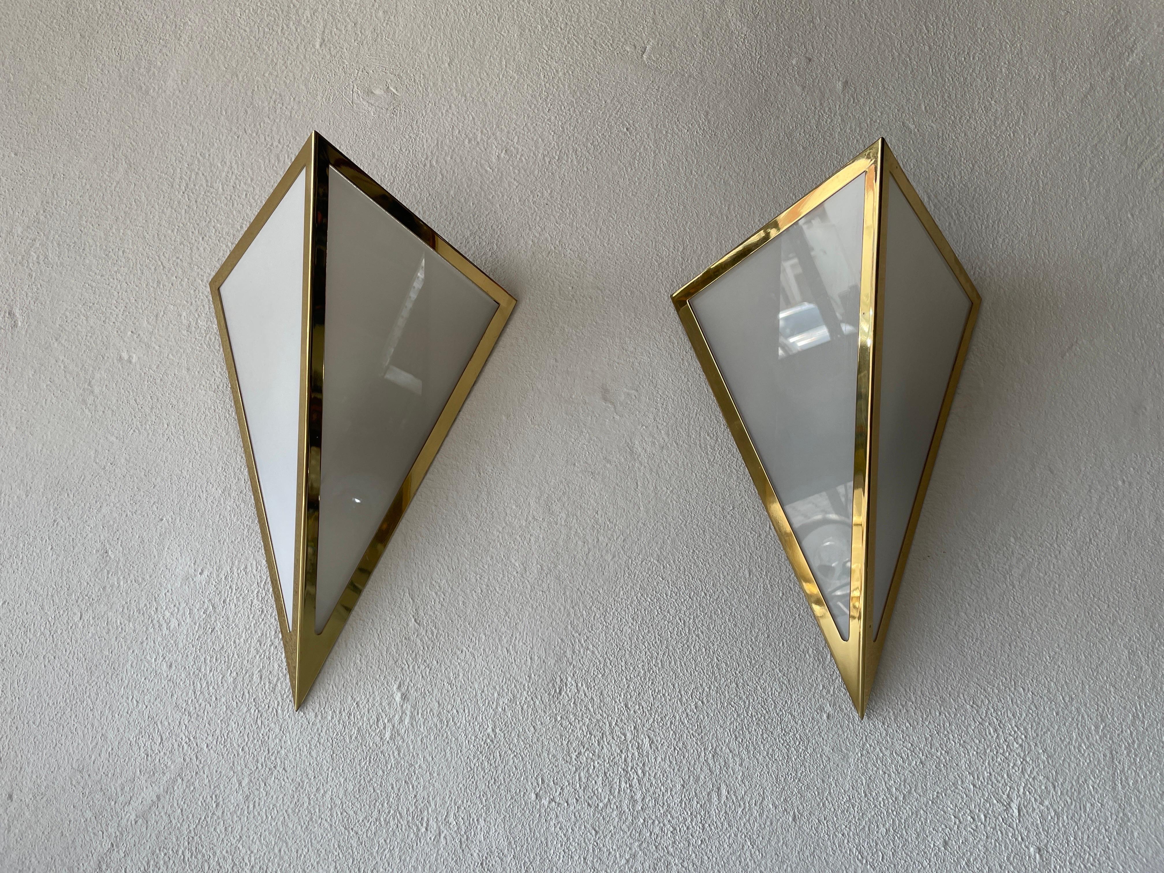 Triangle Design Opal Glass and Gold Metal Pair of Sconces by WKR, 1970s, Germany

Very elegant and Minimalist wall lamps

We have 3 lamps. I made the listing as a pair. But there is a third single lamp if you wish

Lamps are in very good