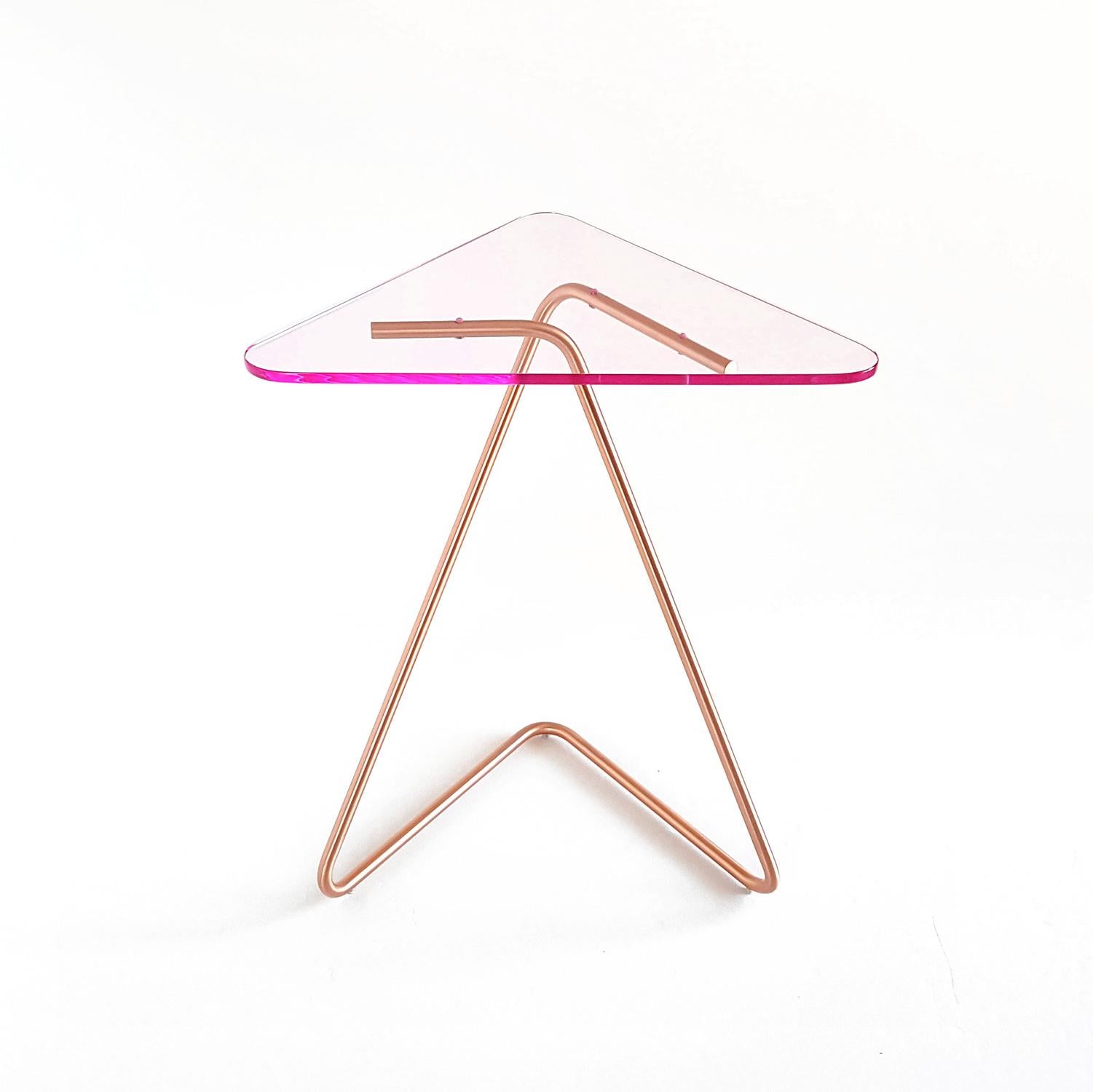 The triangle side table by Rita Kettaneh
Dimensions: The base: brushed stainless steel plated with copper
optionally plated with copper or brass
The top: Acrylic
Materials: H 49.5 x W 41 x D 9.5 cm
Weight: 2.6 Kg

Colors and