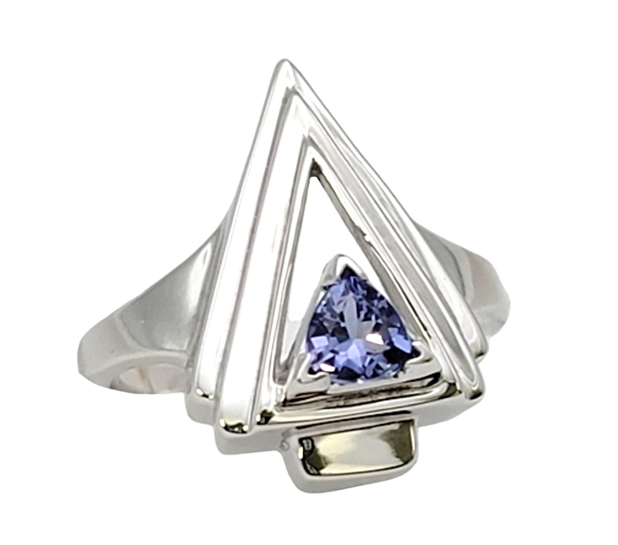 Ring size: 6.75

Sleek contemporary arrow ring in a bright polished platinum setting. The stunning natural violet colored tourmaline stone highlights the modern piece and makes this ring truly shine. 

This lovely ring features a gorgeous .50 carat