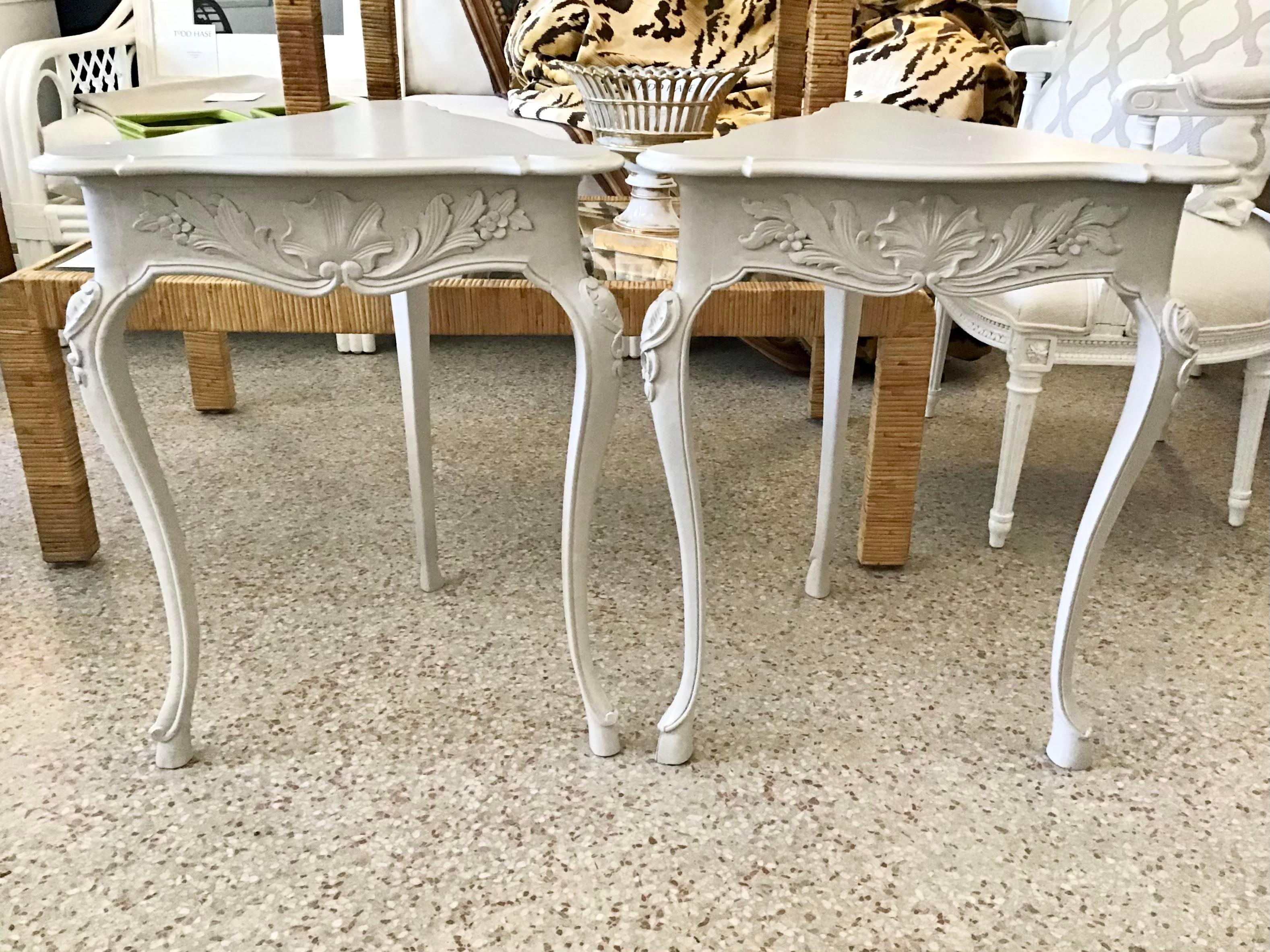 Very nice pair of French side tables with triangular top shape. Classic French carving details on the side and legs of the tables. New gray lacquer finish.