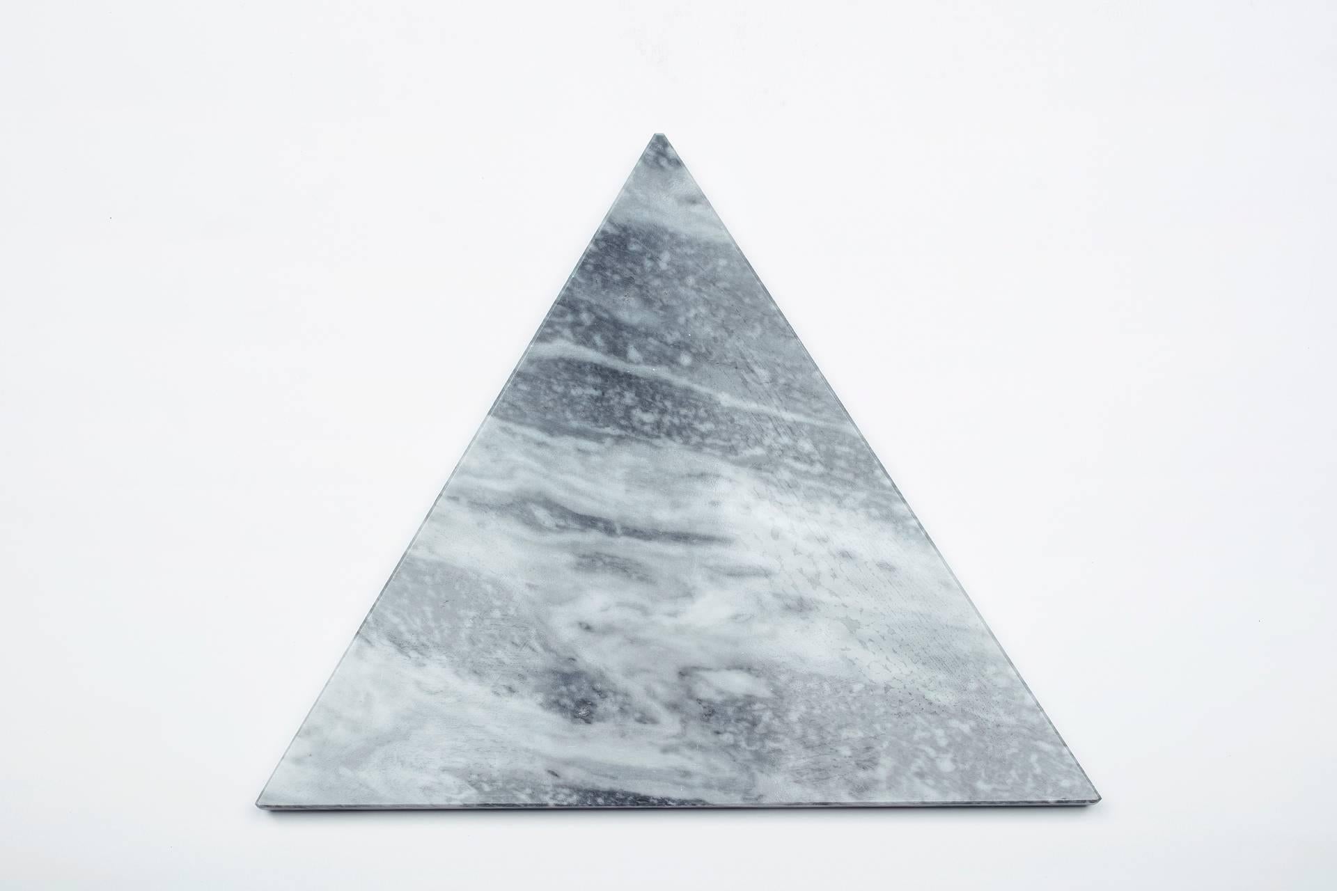 Grey Bardiglio marble cutting board and serving tray with triangular shape and cork underneath. Each piece is in a way unique (every marble block is different in veins and shades) and handmade by Italian artisans specialized over generations in