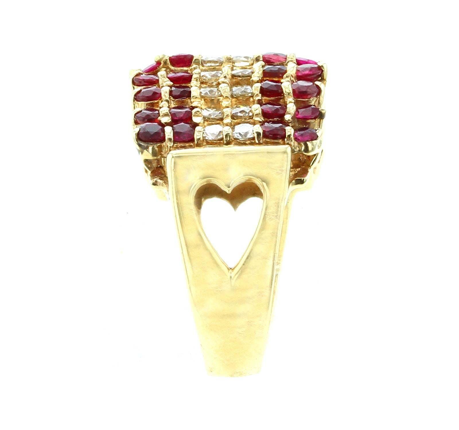 A curved and elevated triangular ring with two rows of diamonds accented with two rows of rubies on each side with a total width of 1