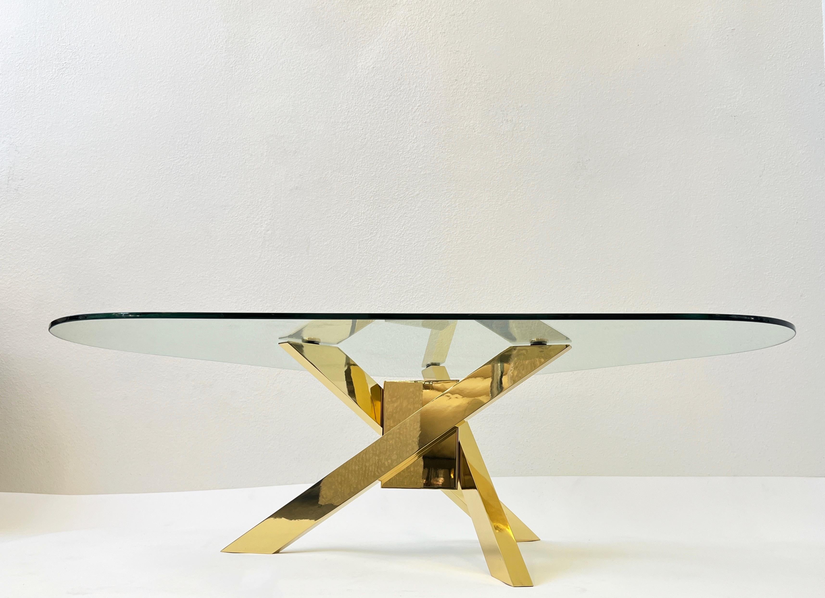 Polished Triangular Shape Glass and Brass Tripod Coffees Table For Sale