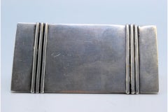 Triangular silver toothpick holder with embossed trim and lid