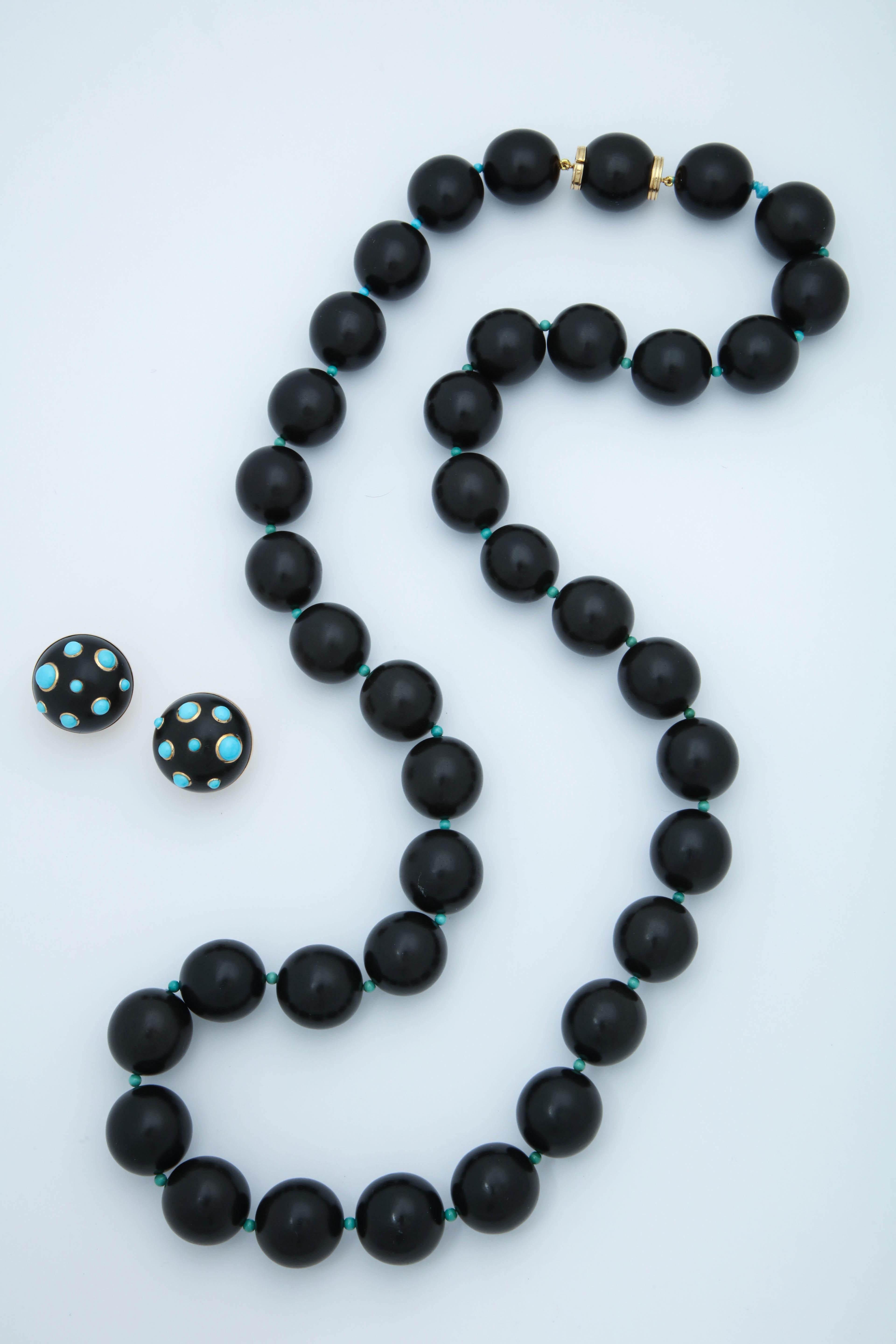 One Ladies 18kt Yellow Gold Ensemble Consisting Of One Pair Of Circular Cut Ebony Earclips Designed With [16] Bezel Set Cabochon Beautiful Color Turquoises.Measurement Of Earrings=Approximately 1InchX1 Inch. Serial # 35057 For Earrings. NOTE: Posts