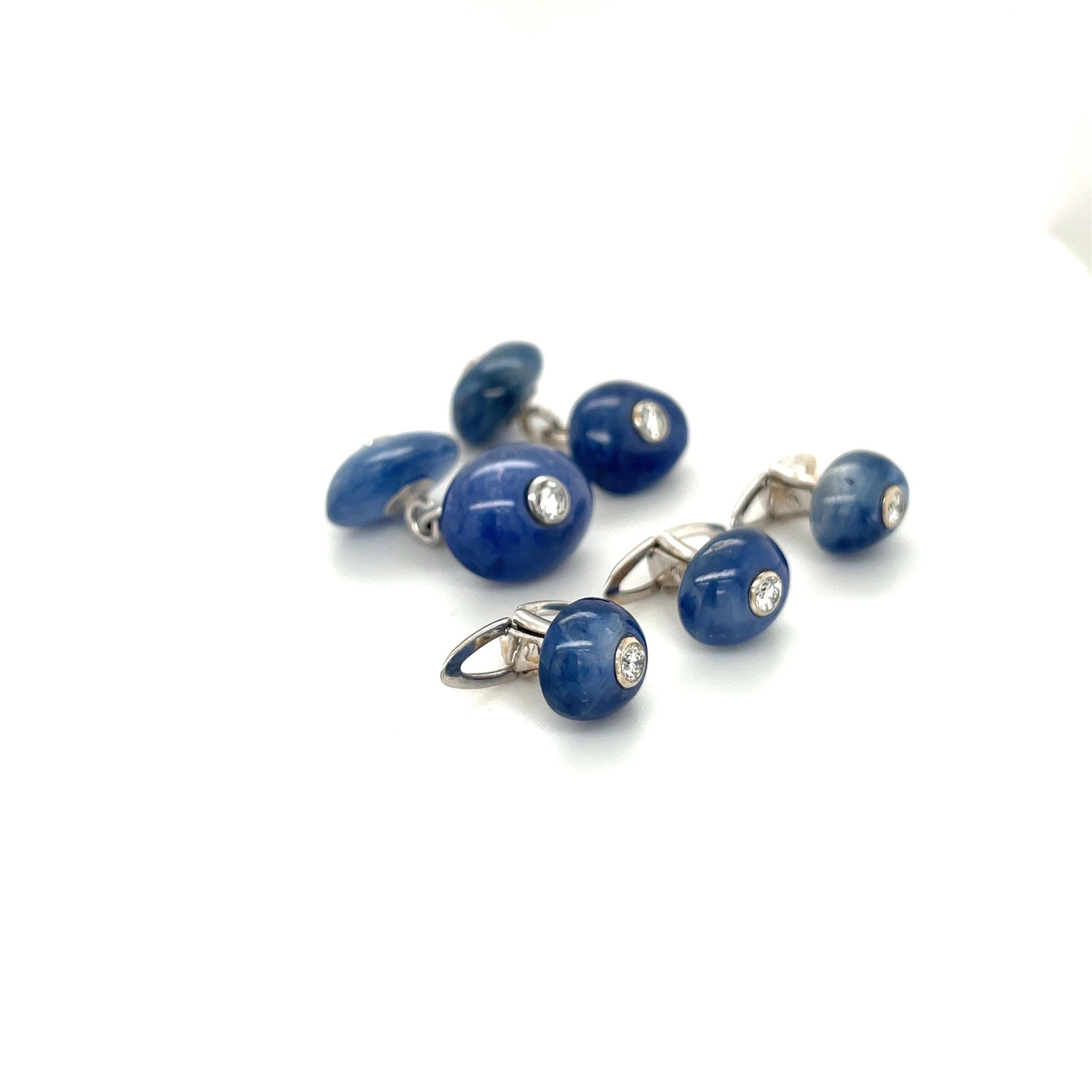 This 18 karat white gold cuff-link /3 stud dress set is designed with polished natural blue sapphire stones. Each sapphire has a bezel set diamond center. The cuff-links are double sided with a chain.
Blue Sapphire Cuff Links =28.00 ct  Diamonds