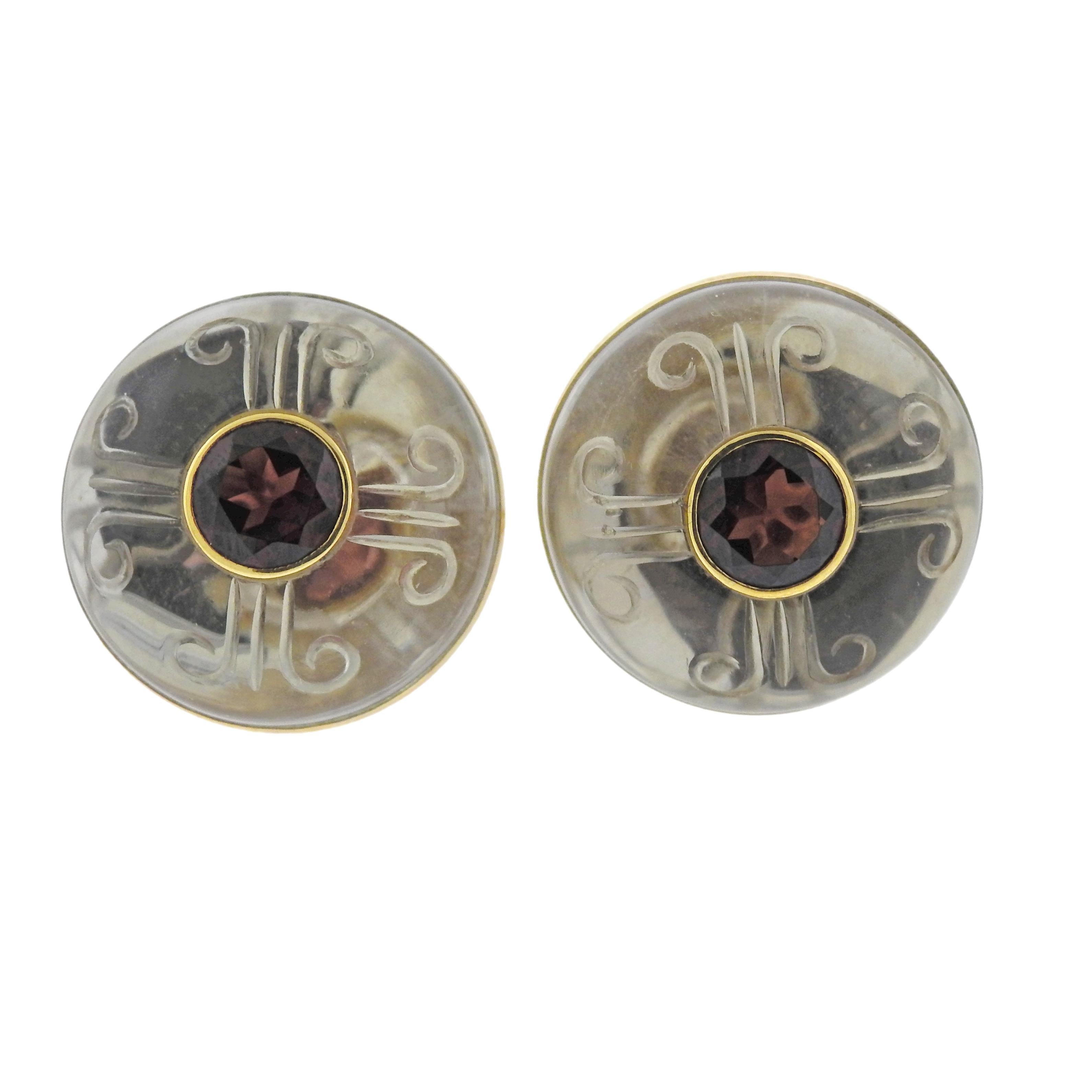 18k yellow gold Trianon earrings, featuring orange/red gemstones in the center and carved crystal top. Earrings are 24mm in diameter , weigh 25.8 grams. Marked: Trianon 750, 32816.