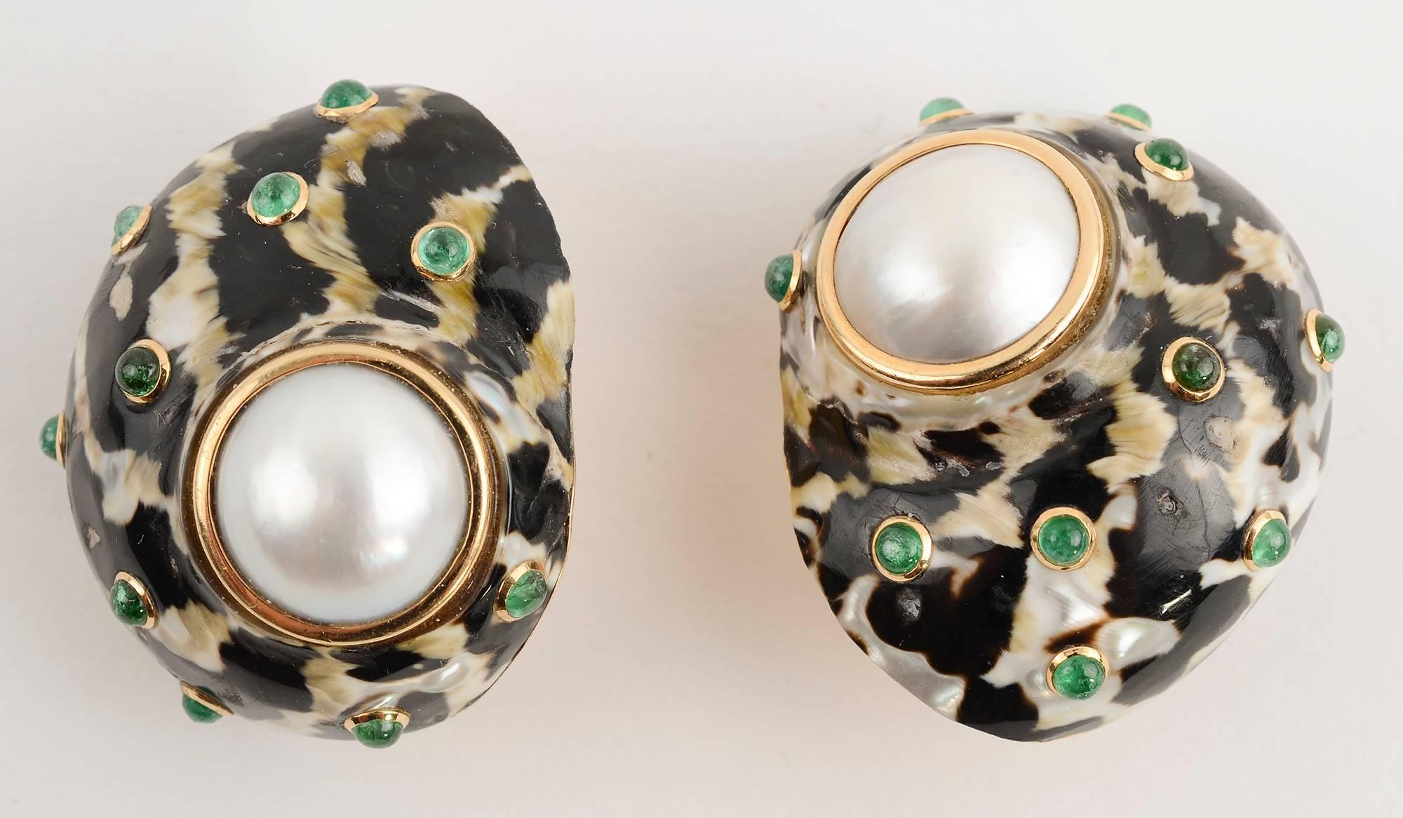 Large, unusual and perfectly stunning earrings by Trianon; circa 1970's. The shells are wonderfully mottled black and white, each with an inset mabe pearl measuring approximately 9/16 