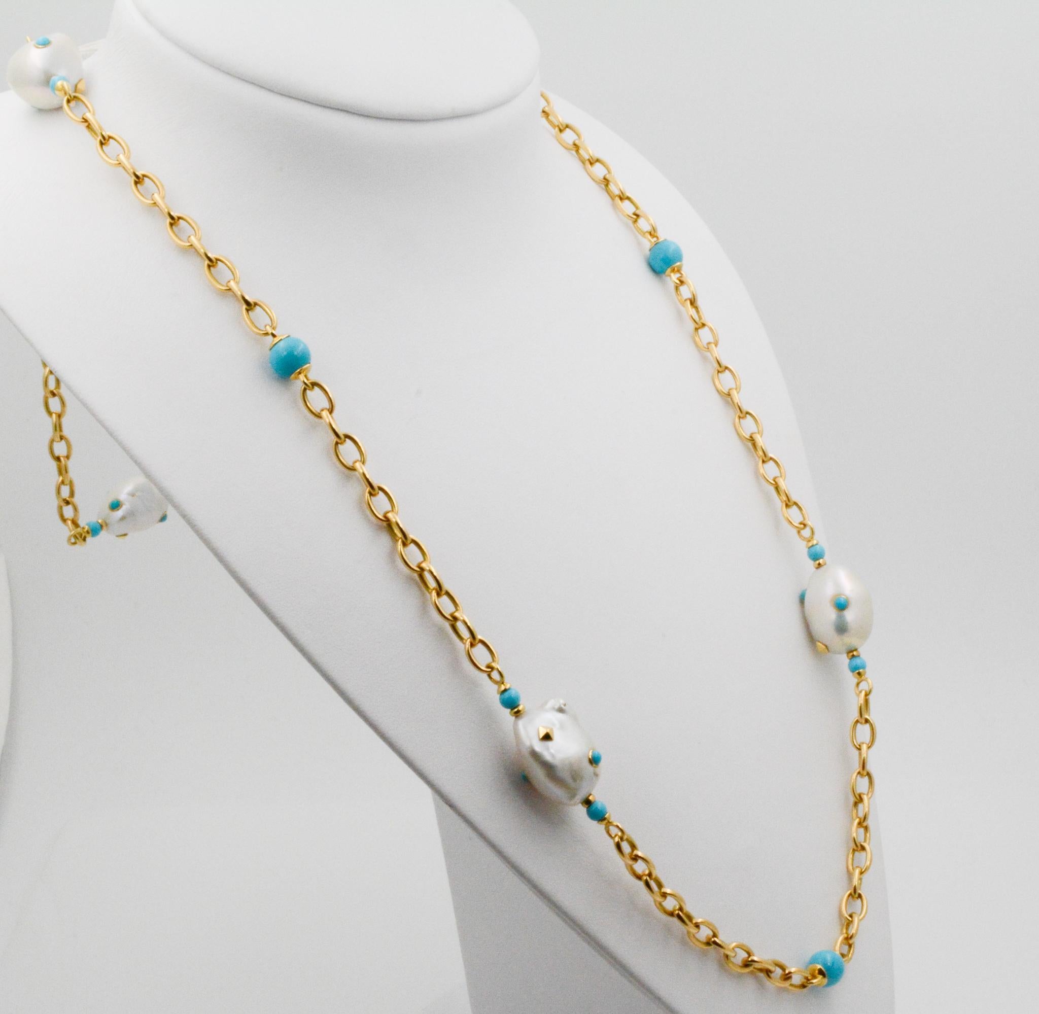 From Seaman Schepps, this 18 karat yellow gold Libson necklace features five baroque freshwater pearl with turquoise and gold square spots and 14 round turquoise beads . The necklace measures at 36 inches long with a turquoise nugget clasp. 