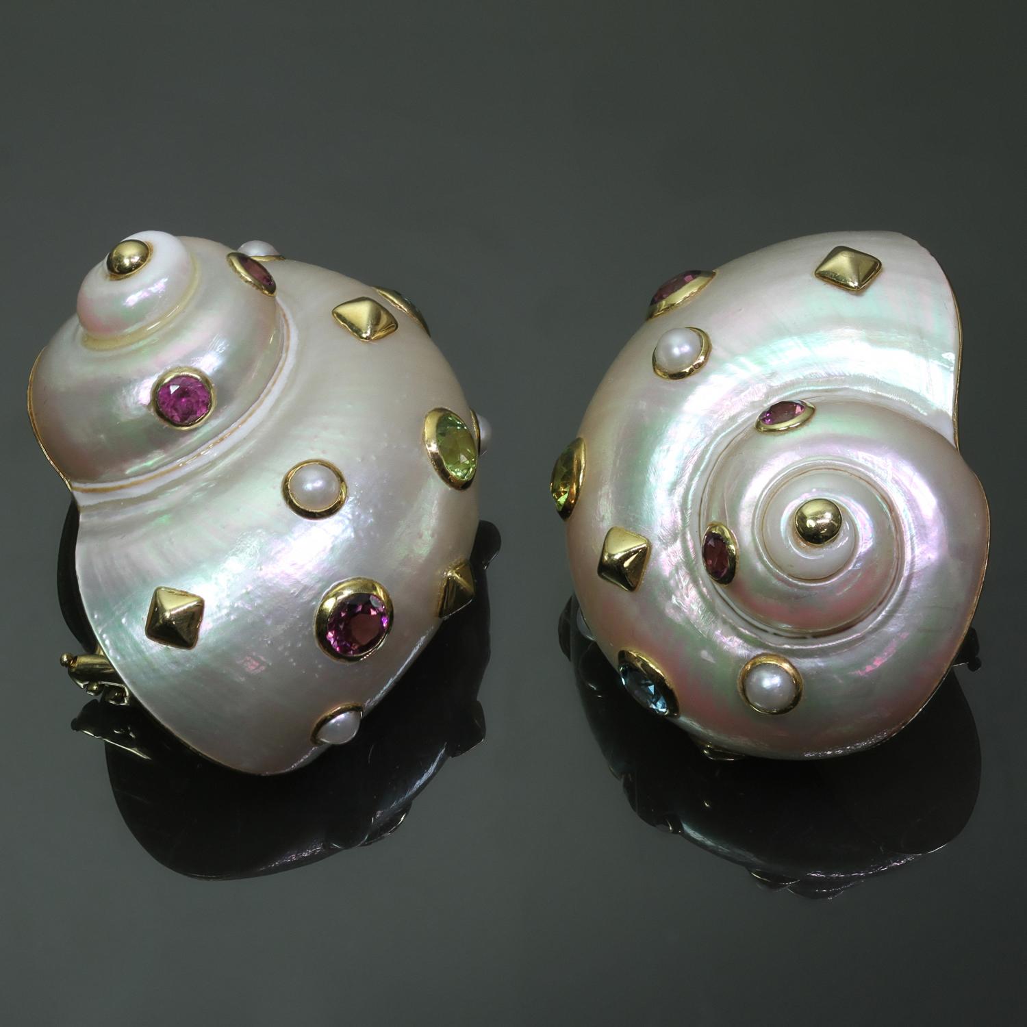 These fabulous nautical clip-on earrings are crafted out of 18k yellow gold and mother-of-pearl shells adorned with a vibrant array of gemstones such as amethyst, peridot, and blue topaz. Measurements: 1.02