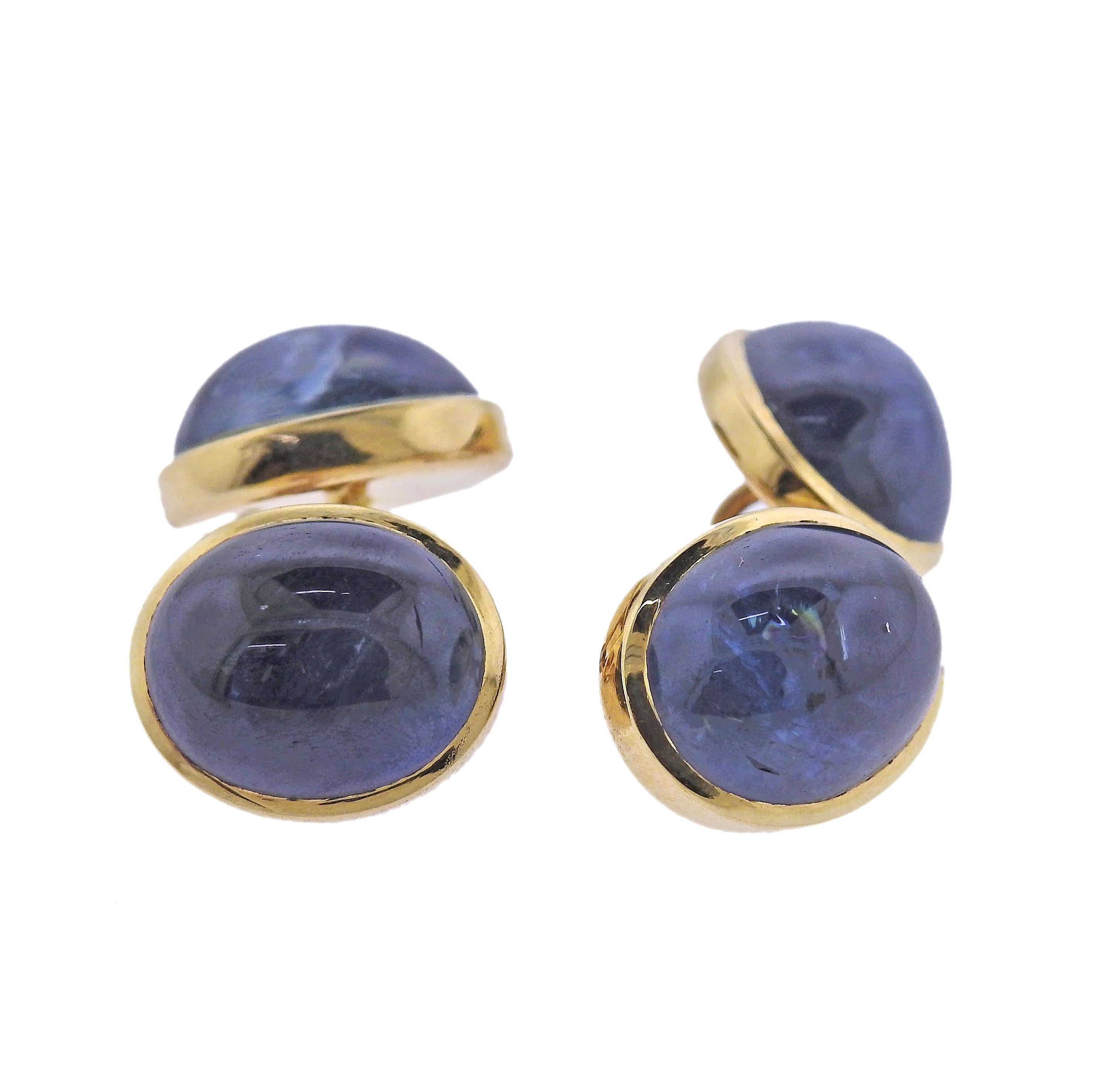 Pair of Trianon 18k gold cufflinks, with sapphire cabochons. Each cufflink top is 13mm x 11mm. Marked Trianon , 18k. Weight - 12.6 grams. 